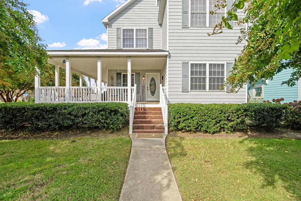 Experience the best of coastal living in this stunning 4 bedroom, 2.5 bath home located in the heart of Historic Cape Charles. Thoughtfully designed to capture sweeping Bay views, this residence offers a perfect blend of charm and modern convenience. With over 900 sqft of decks, you'll never miss another sunset. The main home features an inviting open layout with spacious living and dining areas, ideal for gathering with family and friends. A third floor opens up to a multi-purpose room, ideal for additional guests, or use as a recreational space. An ADU with a full kitchen, one bedroom and one bath is perfect for hosting guests or generating rental income. Enjoy historic Downtown, sunsets over the Chesapeake Bay from the beach, or from your tri-level home view!