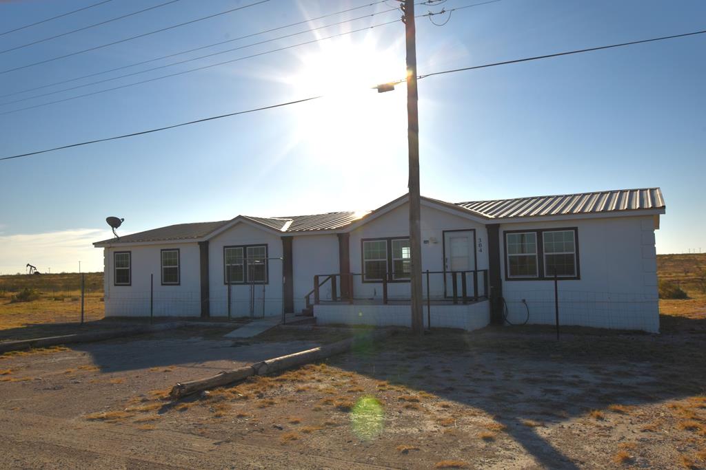 Double Wide Mobile Home that will go Cash or Conventional Loan or Owner Carry ONLY. Perfect for anyone that commutes to Kermit or Goldsmith for work...maybe even workforce housing? It's got good space and is move in ready for someone who would like the remote location!  Water well only produces non-potable water at about 3 gpm, so a storage tank would be a good idea. Make an offer with owner carry terms!