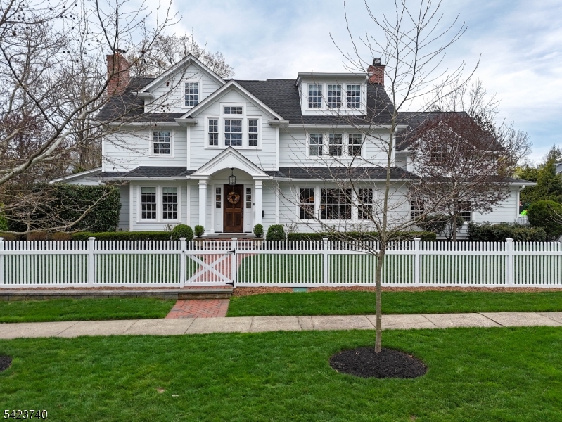 Step into this beautifully reimagined home by Colicchio, where modern design meets exceptional craftsmanship. Thoughtfully upgraded throughout, every space features clean, designer finishes and a seamless attention to detail. Situated on a prime corner lot in the desirable Westfield Gardens neighborhood, this home offers a refined yet comfortable lifestyle in one of the area's most sought-after settings. A stunning chef's kitchen anchors the home, featuring premium Thermador appliances, custom inset cabinetry, and a spacious layout designed for both everyday living and entertaining. Thoughtful design continues throughout with custom millwork, built-ins, designer wallpaper, and beautifully finished spaces at every turn. The primary suite offers a cathedral ceiling and a luxurious spa-like bath with radiant heated marble floors. Natural light pours through Marvin windows, complementing the rich red oak hardwood floors and curated designer lighting. Modern comfort and efficiency are seamlessly integrated with multi-zone HVAC, smart home features, and whole-home connectivity. The finished basement provides flexible space for recreation, fitness, or entertaining, while the double-wide garage and professionally landscaped, fully fenced yard enhance everyday convenience. Outdoor living is elevated with a bluestone patio, privacy hedges, and a dedicated play and sport area. A rare opportunity just 20 miles from NYC in the heart of all Westfield has to offer!