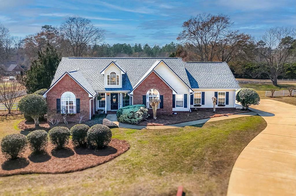 Located on the sought-after south side of Thomasville, you're just 30 minutes from the Tallahassee Trader Joe's and only 9 minutes from shopping and dining on the bricks in downtown Thomasville. This beautifully updated 3-bedroom, 2-bath home is move-in ready with new LVP flooring, fresh paint, designer wallpaper, and modern lighting throughout. The vaulted living room with fireplace offers a warm, inviting feel, and the kitchen features new countertops, a stylish backsplash, and under-cabinet lighting. The spacious primary suite includes a walk-in closet, garden tub, separate shower, and dual vanities. Upstairs, a versatile loft makes the perfect office, playroom, or optional fourth bedroom. A spacious laundry room, pantry  and 2-car garage also provide tons of storage space. And with a 2022 roof and a fenced backyard complete with a freestanding kennel, this home checks all the boxes. Schedule your private tour today!