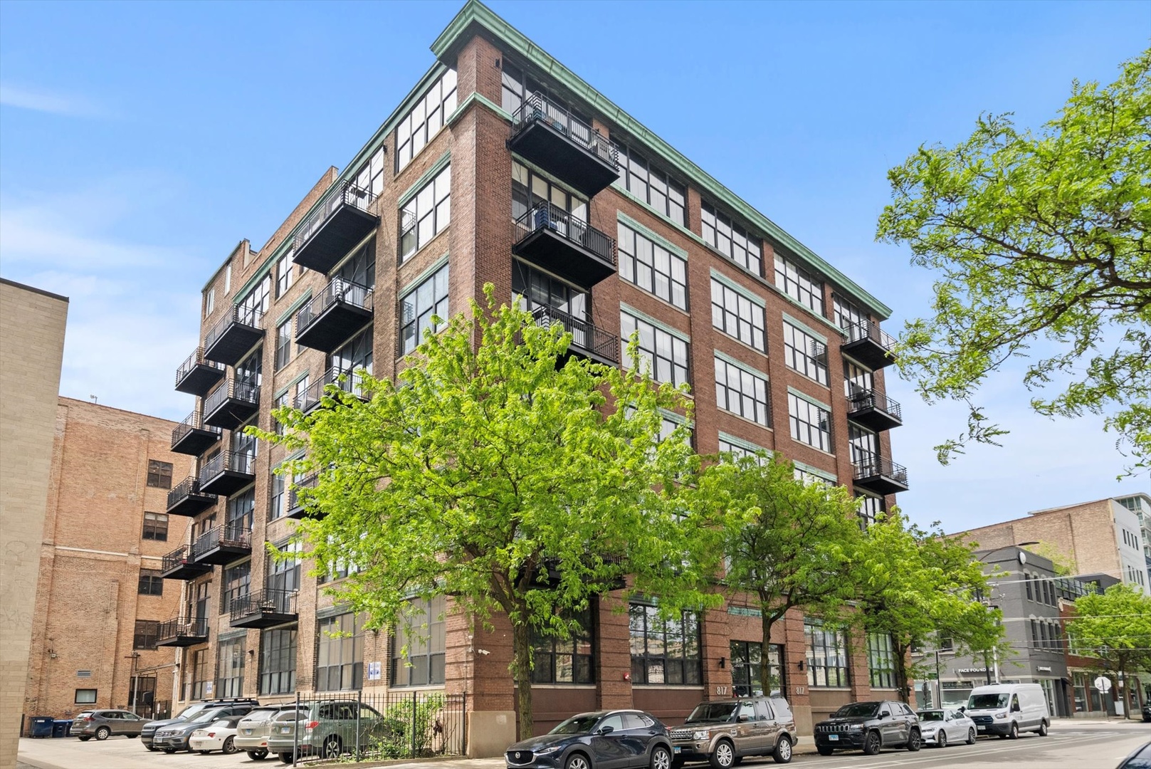 Perfectly positioned at Washington & Green St, just one block south of Randolph's Restaurant Row and Fulton Market. This condo, fully renovated in 2025, offers the ultimate West Loop lifestyle. Surrounded by Chicago's top dining, retail, and nightlife destinations, the home combines historic loft character with today's modern luxury. Inside, soaring 12-foot ceilings, exposed brick and ductwork, and newly refinished solid hardwood floors, frame oversized east-facing windows with skyline views and abundant natural light. The brand-new chef's kitchen is a centerpiece, featuring high-end Bosch appliances, waterfall-edge quartz countertops and backsplash, a deep workstation sink with premium accessories, and custom cabinetry. The thoughtful split-bedroom layout includes a private east-facing balcony overlooking downtown, perfect for morning coffee or evening wine. Both bathrooms were fully renovated in 2025 with spa-inspired finishes, contemporary tilework, designer vanities, and premium fixtures. Freshly painted walls throughout make this a true move-in-ready home-nothing left to do.  Deeded gated parking is available in this boutique elevator building. Just steps from Parlor Pizza, Sawada Coffee, Nobu, Soho House, Whole Foods, and the very best of West Loop living. This home is a rare opportunity in one of Chicago's most sought-after neighborhoods.