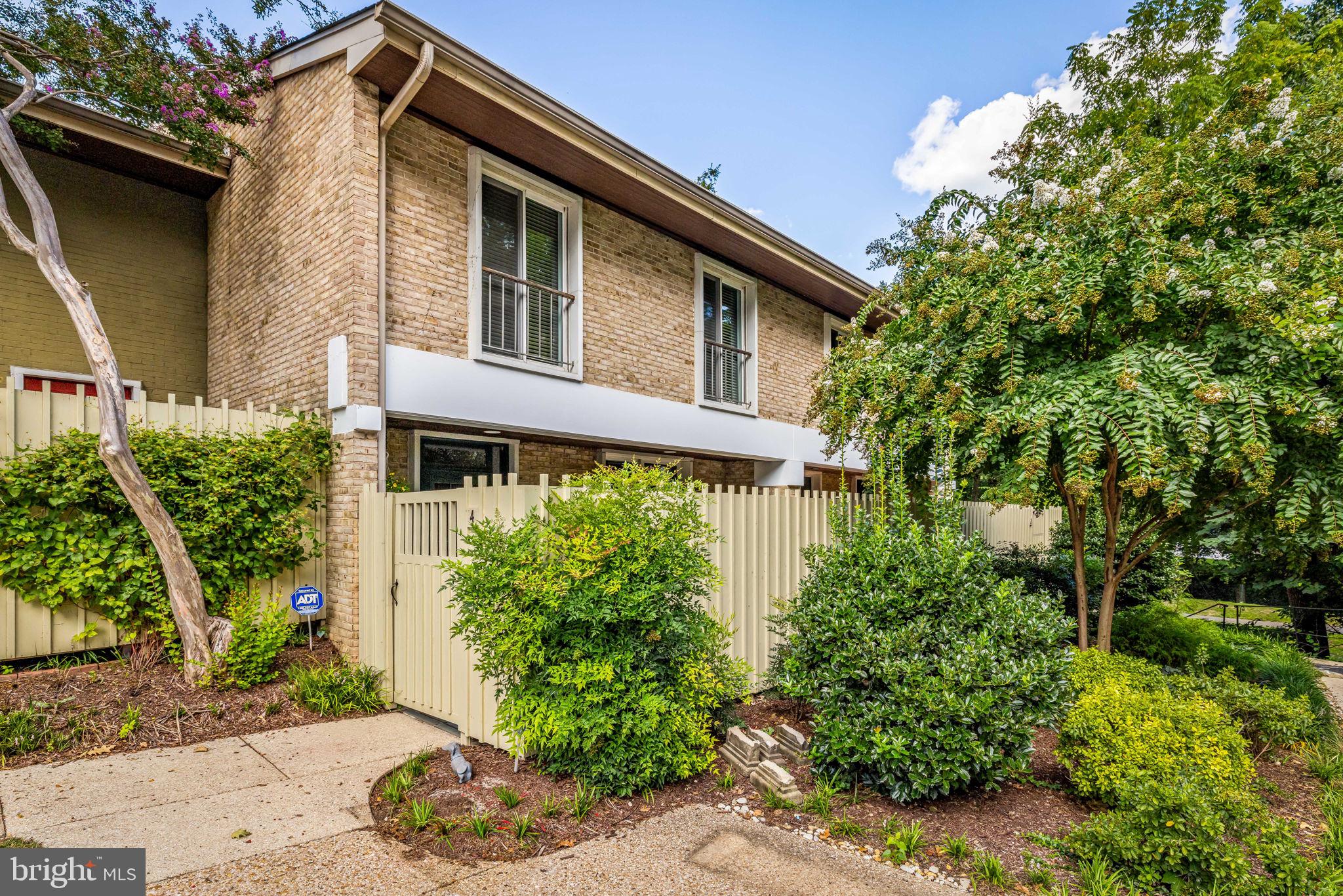 Mid century design, simple and clean, with windows and doors that bring the outside in.  This well designed home has been meticulously renovated over the years and provides efficient living spaces that are beautiful and comfortable.   The living room opens to a magnifcent and private slate patio with seasonal gardens and  a pond.  There is a  gas fireplace in the living room  flanked by glass bookshelves.  The spacious eat-in kitchen has a built in desk and opens to another patio which is the perfect place to grill or read a book.   There are pella windows throughout, updated kitchen and baths and ample storage both in the home and in the lower level storage room.  One parking space is designated and there are 3 pools to enjoy in the summer months.  BRAND NEW HVAC SYSTEM!Enjoy all that Cross Keys has to offer - pickleball, pools, shopping, walking trails and restaurants.  A wonderful gated community in the perfect location