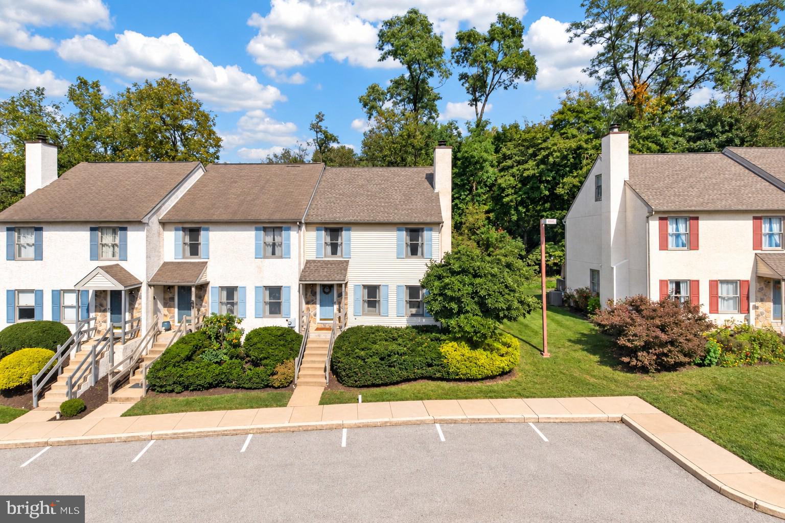 Enjoy the setting of this well-maintained END-UNIT townhome in the quaint Pickering Station community in Chester Springs, located in the Downingtown Area School District, including Downingtown East High School and the STEM Academy. Offering 3 bedrooms and 2.5 baths, the home features an open floor plan that creates an easy flow on the main level.The great room features a fireplace and new LVP flooring, with plenty of room for a dining area or home office. Just beyond, the updated kitchen features quartz countertops, a glass tile backsplash and new stainless-steel dishwasher, refrigerator and microwave. The adjoining breakfast room is accented by a new light fixture, while an updated sliding glass door opens to the rear deck overlooking a scenic tree-lined backdrop.Upstairs, two spacious bedrooms with ceiling fans include one with a private bath featuring a new quartz countertop, vessel sink and light fixture. A hall bath with tub has also been refreshed with a new quartz countertop, vessel sink and light fixture. Continue to the third floor where a versatile room with a closet can serve as a third bedroom, home office or bonus room. Additional living space can be found in the finished lower level, complete with a recreation room and bar. A separate utility room includes laundry facilities and convenient shelving for storage. Pickering Station is an established community of just 39 townhomes tucked away on a private cul-de-sac street, with plenty of parking for residents and guests. Enjoy easy access to the PA Turnpike, major routes, train stations, shopping and dining. This move-in ready home offers plenty of space to enjoy in an ultra-convenient Chester Springs location.