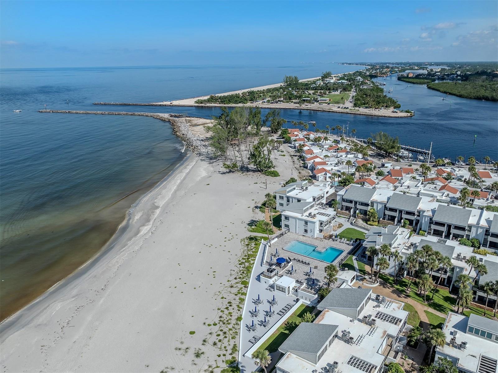 Welcome to Bahia Vista Gulf, a tropical beachfront condominium community on Venice Island offering relaxed coastal living with spectacular Gulf views. Residents enjoy a large, heated pool overlooking the beach, expansive sun decks ideal for gathering with friends and neighbors, and unforgettable sunsets over the Gulf. Unit H-242 is a light-filled second-floor residence featuring an open-concept design with soaring ceilings andtwo private balconies. The inviting living room showcases a beautiful wood-clad vaultedceiling and offers partial views of the Gulf of Mexico along with the lush courtyard below.The renovated kitchen is thoughtfully updated newer appliances and includes a washerand dryer for added convenience. A sliding glass door provides direct access to one ofthe private balconies, perfect for enjoying your morning coffee or evening breeze.Recently painted and offered turnkey furnished, this residence also features windowtreatments throughout and hurricane-rated windows and sliding glass doors forenhanced protection and peace of mind. A designated parking space and generousground-floor storage - ideal for beach chairs, bikes, and sporting equipment - areincluded, with ample guest parking nearby. For those who prefer low-rise living, thischarming tropical community offers an intimate alternative to high-rise condos, all withinone of Venice Island’s most desirable beachfront settings.