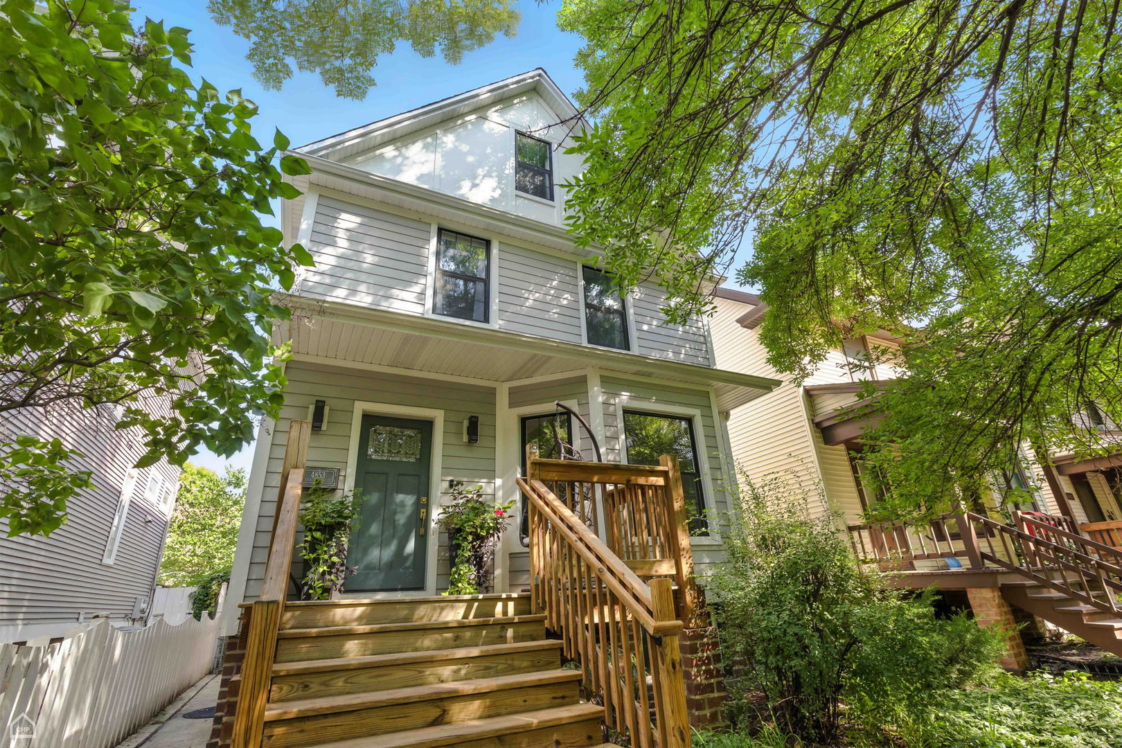 Stunning and spacious 5-Bedroom Single Family Home in Lincoln Square, close to Winnemac Park! This updated home offers the perfect blend of character, space, and modern comfort. With 5 bedrooms up and 3.1 baths, it provides incredible flexibility for today's lifestyle. The main level is ideal for entertaining, featuring a formal living room, elegant dining room, and a thoughtfully updated kitchen with large peninsula/breakfast bar that flows seamlessly into a massive family room. This addition has wood burning fireplace (with gas starter), skylights, vaulted ceilings & full bath. The second level features 4 bedrooms and a full bath, while the top floor is dedicated to a serene, recently-finished primary suite with bright, white bath with double sinks and huge walk-in shower with window. Downstairs, the finished basement adds even more living space-with a rec room, bonus office, laundry and half bath, plus an entire extra storage room. Step outside to enjoy a fully fenced rear patio and deck, offering plenty of space for outdoor gatherings (great spot for outdoor movies), dining, with outdoor speakers, privacy fence, hot tub hookup, vegetable garden beds, hot and cold water spigots, patio area, mature landscaping and water fountain. A 2-car garage, dual-zoned HVAC and Hardie Board Siding complete this home. All of this in an amazing Lincoln Square location - just minutes to restaurants, shops, CTA Brown Line, Metra, farmer's market, LA Fitness and green space. Come home!