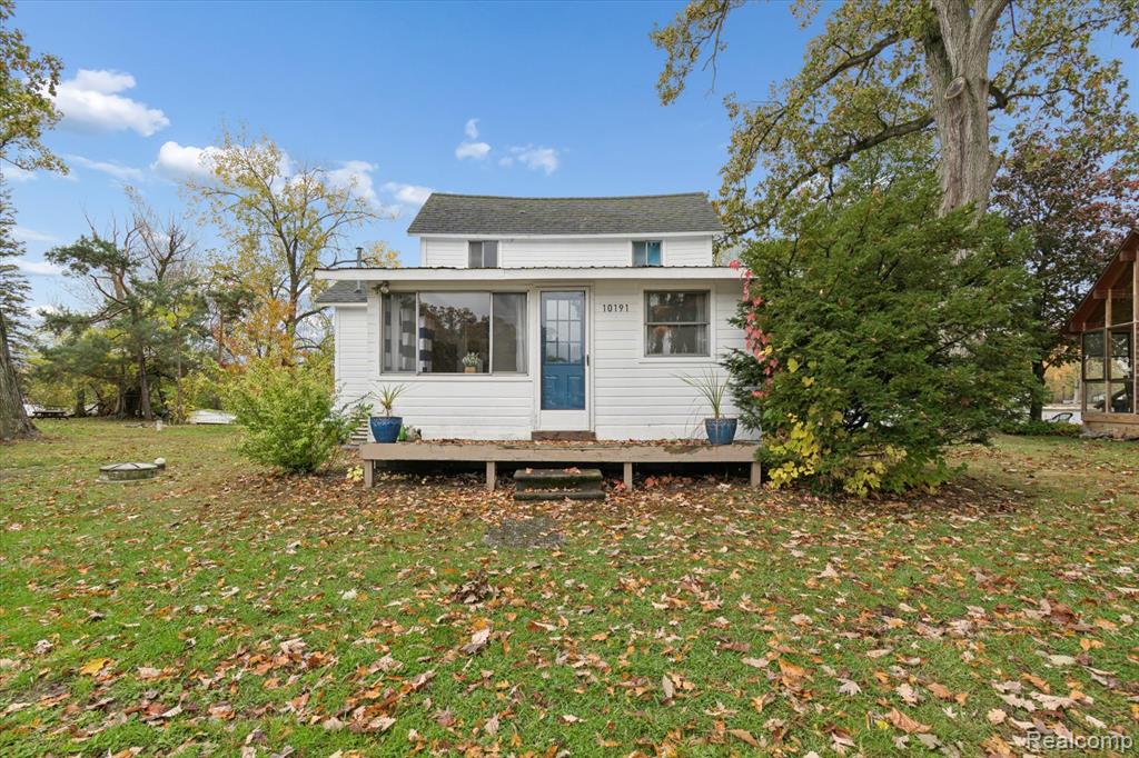 Enjoy the best of lakefront living in this remodeled, charming, 2-bedroom bungalow with water views from both the front and back — offering a stunning sunrise and sunset every day. Nestled between Devil’s Basin and Strawberry Lake, you can sit on the covered lanai and watch the boats go by on Devils Basin or relax with breathtaking sunset views over Strawberry Lake. The large concrete firepit is perfect for those bonfires with friends and family while looking out at the water. This home features a private dock, a brand-new 22'x28' shed for your lake toys and an attic with extra storage space. Inside, you’ll love the spacious, newly renovated kitchen with all new stainless steel appliances and new flooring throughout the home. New all-in-one washer and dryer is a perfect space saver and the painting inside and out has been done for you. Those big ticket items such as furnace, tankless hot water heater, well, water lines and drainage lines are all brand new. . Parking is in a shared community area and you walk along the easement along the Devil Basins side to access the home. Whether you’re looking for the perfect cottage getaway or ready to do a little DIY-ing to make it your year-round home, this lakefront home delivers comfort, charm and endless waterfront enjoyment