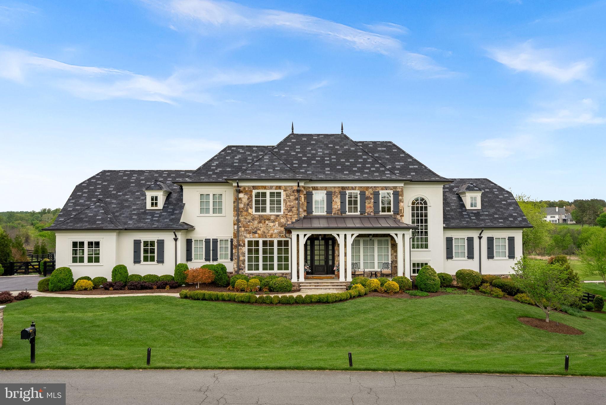 Resort-Inspired Living Behind the Gates of Creighton Farms.  40192 Jefferson Springs Court offers an extraordinary opportunity to experience refined luxury living surrounded by breathtaking golf course and mountain views. Perfectly positioned overlooking the 18th and 1st holes of the renowned Jack Nicklaus Signature Course, this exceptional estate captures panoramic vistas and unforgettable sunsets from some of the community’s most coveted frontage.Thoughtfully re-designed in 2022, the property is perfect for both grand-scale entertaining and comfortable everyday living, the residence showcases soaring ceilings, expansive windows, and a light-filled open floor plan that seamlessly blends timeless elegance with modern functionality. Sophisticated architectural details and refined finishes create a warm yet elevated atmosphere throughout.At the heart of the home, the gourmet chef’s kitchen features premium appliances, generous prep and gathering spaces, and effortless flow into the home’s inviting living and dining areas. Multiple entertaining spaces provide flexibility for intimate evenings or larger gatherings, while spacious bedrooms and luxurious baths offer peaceful private retreats for family and guests alike.Outdoor living is equally impressive, with beautifully designed terraces and patios that are perfectly oriented to capture the stunning fairway views.  Whether enjoying a quiet morning coffee, relaxing at sunset, or hosting guests under the stars, the setting is truly spectacular.Residents of Creighton Farms enjoy the option to join the prestigious Creighton Farms Club, offering world-class amenities including championship golf, tennis and pickleball courts, resort-style pools, fitness and wellness facilities, fine dining, and a vibrant social calendar — all within one of Northern Virginia’s most sought-after private communities.Ideally located in Aldie with convenient access to Washington, DC, Dulles International Airport, and the surrounding wine country and equestrian estates, this remarkable property presents a rare opportunity to enjoy luxury resort-style living at its finest.
