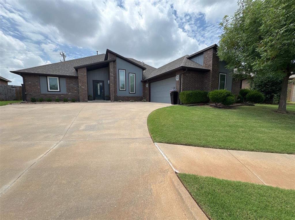 This beautifully designed home combines sleek modern finishes with warm, inviting touches. The open-concept kitchen features dark espresso cabinetry, quartz countertops, a spacious island with sink, stainless steel appliances, stylish pendant lighting, and a gorgeous tile backsplash. Perfect for both cooking and entertaining.The living area offers a contemporary fireplace with a striking stone accent wall, built-in shelving, and dramatic lighting features, creating the ultimate cozy-yet-modern space to relax or entertain guests.