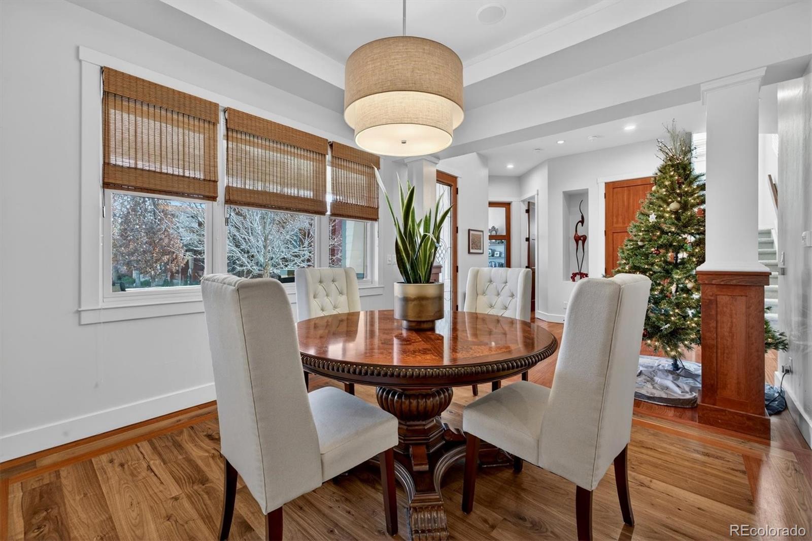 Pride of ownership is evident throughout this meticulously maintained Craftsman-style residence, ideally situated on a corner lot fronting a serene community park in sought-after Bradburn Village, just 20 minutes southeast of Boulder. Bradburn is known for its walkable shops, dining, neighborhood events, and resort-style amenities, including trails, a pool, and tennis courts. Offering over 5,300 finished square feet, this home includes a private two-bedroom, one-bath carriage house with its own exterior entrance, ideal for extended family, guests, multigenerational living, or long-term rental potential. A wraparound front porch creates a welcoming first impression. A newly installed cedar fence (2025) encloses the private backyard, featuring a built-in fire pit, a refreshed paver patio, and a discreetly integrated dog run. // The interior features soaring ceilings, refinished hardwood floors (2024), designer lighting, and crisp baseboard detailing throughout. The remodeled chef’s kitchen features custom Shaker cabinetry, stainless steel appliances, and a quartzite island that opens seamlessly to the living and dining areas for effortless entertaining. The living room features a gas fireplace with a natural stone surround. A formal dining room and main-floor office (or optional bedroom) complete the main level. // Upstairs, the reimagined primary suite offers a spa-inspired bath with Carrara marble, soaking tub, walk-in shower, and a generous walk-in closet with private access to the carriage house. Two additional bedrooms, a full bath, loft, and upper-level laundry provide functional and flexible living space. // The finished basement includes a bedroom, bathroom, recreation room, den, and custom bar, ideal for sports enthusiasts, entertaining, or relaxing. // Additional upgrades include: new furnace (2025), new roof (2024), new dryer (2025), poly-aspartic garage floor coating (2025), newer windows, newer carpet, and newer water heater.