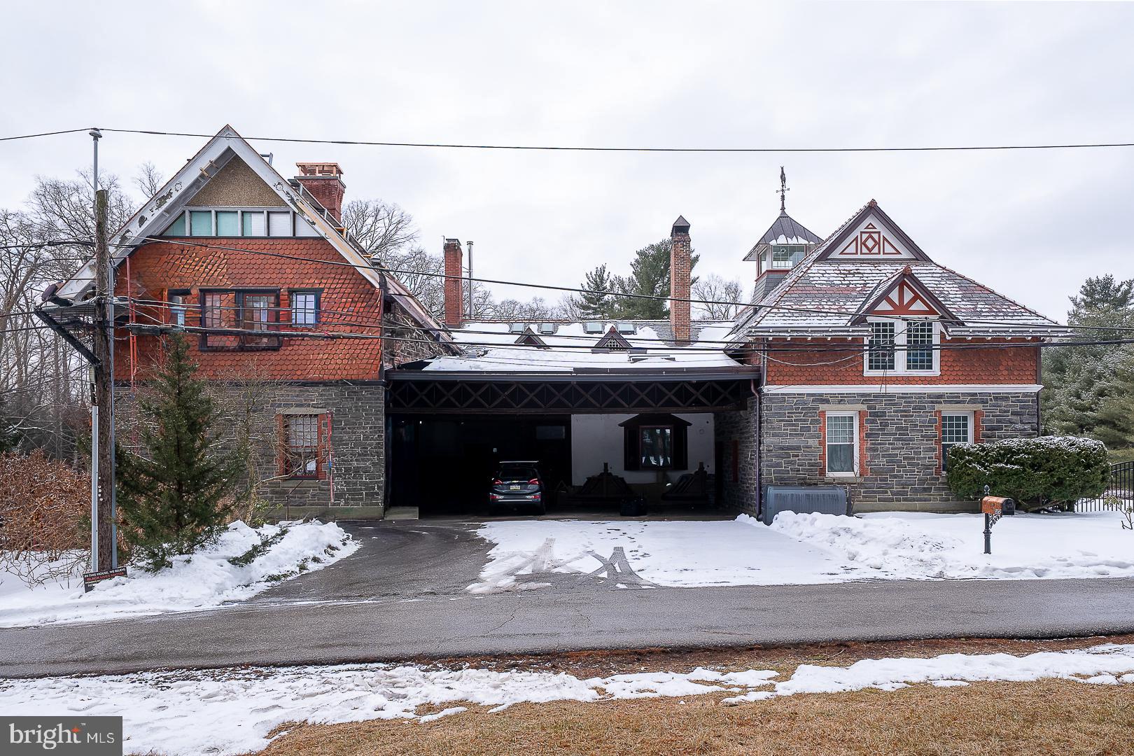 A RARE GEM IN THE HEART OF BRYN MAWR, PA!Set back on 0.88 acres at 266 Beechwood Dr. in Bryn Mawr, this 1889 stone twin, originally the carriage house for the former Wentworth Estate, blends period character with privacy. A new slate roof is in progress, and the carport/loft roof includes solar panels. Distinctive details include a turret, original stonework, and three fireplacesApproximately 4,630 square feet with five bedrooms and three‑and‑a‑half baths across nine rooms. EV‑ready with a dedicated charger. Electric heat, public water, and on‑site septic. Radnor Township and Radnor School District. Walk to Garrett Hill dining and shops, with nearby train access.Secluded setting surrounded by mature trees, plus a small backyard pond and two rain gardens that receive storm water via underground conduit. Beechwood Drive is a private lane with shared maintenance for paving and snow removal; township handles trash.Note: The primary bedroom fireplace is not safe to use until inspected and repaired by a qualified professional.  Front door re‑varnishing and second‑floor turret window work in progress. Public records may show 266 S Roberts Rd; title and township list 266 Beechwood Dr.