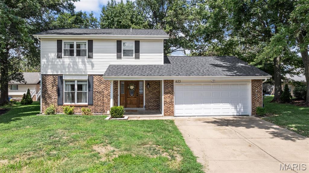 Welcome to 655 Lakewood Dr. This beautifully updated 3 BR 2.5 BTH 2 story home is located in the highly desirable Lake St. Louis Community Association giving you access to incredible amenities including 2 lakes, clubhouse w/restaurant & bar, fitness facility, 2 swimming pools, beach, tennis courts, par 3 golf course, marinas & more. Nestled on a quite cul de sac this home features brick and vinyl front & 2 car garage. Inside you'll find an open floor plan w/fresh neutral paint & inviting laminate flooring throughout most of the home. To the left of the entry is a living rm w/crown molding & a large picture window allowing in tons of natural light. The spacious family rm features a cozy WB fireplace & sliding glass door that opens to the back deck perfect for outdoor enjoyments. You'll love the updated kitchen w/custom cabinetry, granite countertops, tile backsplash, center island w/bfkt bar, SS appliances & adjoining dining rm. Upstairs the primary suite offers a private, updated full bath w/walk in shower. 2 add'l bedrooms & full bath complete the upper lvl. The clean LL is perfect for add'l storage or ready for your custom finish for added living space. Enjoy the best of Lake St. Louis living in this MOVE-IN-READY home w/easy access to major hwys, AAA Wentzville School District & is close to shopping & restaurants. Don't miss out and schedule your showing today!