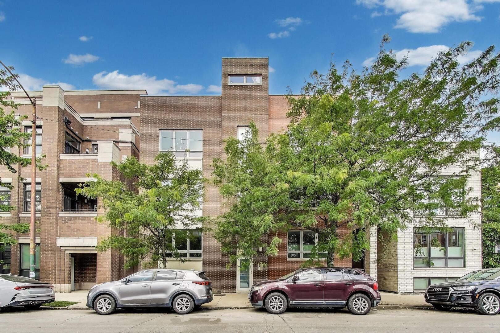 Welcome to this spacious 3-bed, 2.1-bath duplex-up in an all-brick building within the sought-after Prescott Elementary School District. This penthouse lives like a single-family with two full floors of living space and three private outdoor areas, including a large rooftop terrace with skyline views. The main level offers a sun-filled open floor plan with hardwood floors, tall ceilings, and oversized windows. A spacious living area flows into the dining space and a fully updated kitchen featuring quartz counters, white cabinetry, high-end stainless appliances, and a large island. The luxe primary suite includes a walk-in closet, spa-like bath with dual vanity and walk-in shower, plus access to a private balcony. A designer powder room, full-size laundry room, and custom mudroom complete the level. Upstairs are two additional bedrooms, a full bath, and a large living room with custom bar- perfect for entertaining or a second living space. Enjoy both front and rear rooftop terraces ideal for lounging, dining, or taking in sunset views. Thoughtful touches throughout include custom closets, designer lighting, and wallpaper accents. Garage parking is included.Prime Lakeview location near Chi Che Wang Park, Whole Foods, dining, and transit.