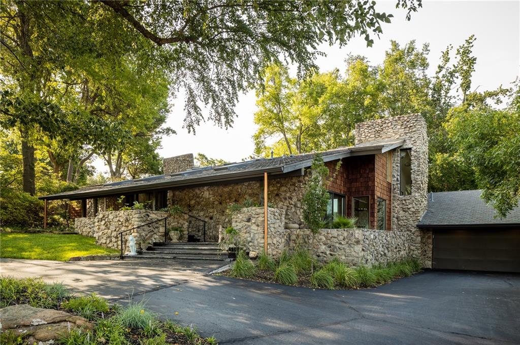 A Norman Historical Home…Originally built by OU Football Coach Barry Switzer, this 3-bed, 3.5-bath home is full of character — and fully updated. Completely reimagined in 2021 by Swiftco Renovation, the open main level features a stunning stone fireplace, while upstairs you’ll find two en-suite bedrooms including a spacious primary suite with a private sitting area and its own fireplace.Outside, a heated Pebble Tec pool, outdoor fireplace, and covered seating area make year-round entertaining effortless. Two laundry rooms, generous storage, and a whole-home generator round out this one-of-a-kind property — just a short walk to the University of Oklahoma.