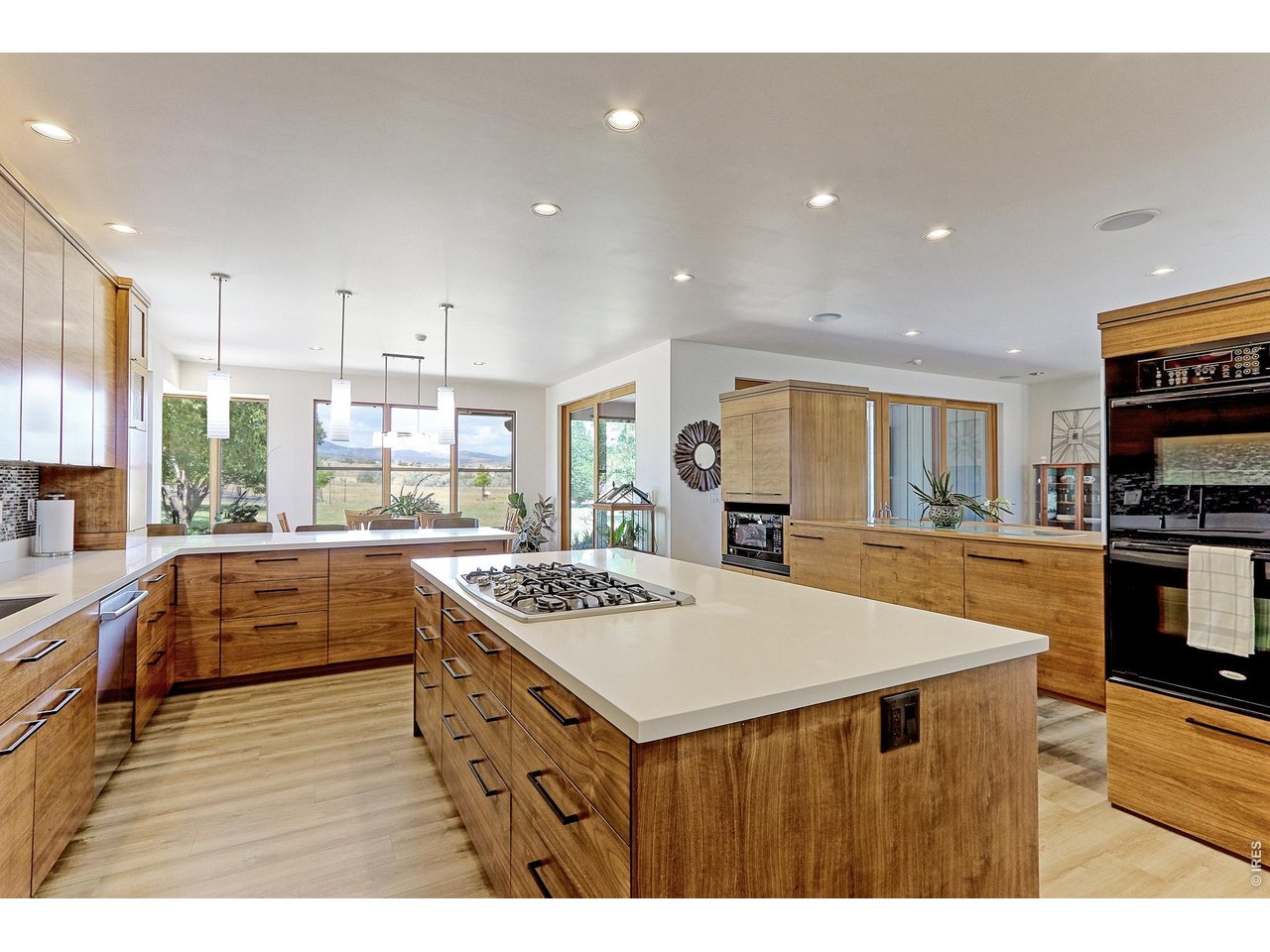 This acreage property is very special and was built for comfort, style and convenience. This custom home was designed by award winning designer David Hueter & built by custom home builder Darrel Amelang with features such as custom hand-built cabinetry & designer upgraded features throughout with too many other things to mention here. As you drive through the private secured entry gate with code or remote you will be blown away by the architecture of this home. This solid 2x6 constructed home has steel beam supports throughout, custom Sierra Pacific wood clad windows everywhere, heavy standing gauge seam metal roof, cad 5 wire and multi station inside and out surround sound & all hi end mechanicals in place. The entire 35+ acres is fenced, for your horses or livestock which includes custom designed metal drill pipe fence with welded pipe corners and gate separation of front and back of property. You must see the back of the property with gorgeous pastures, rock out cropping's and lots of wildlife. There is a large party pavilion and with firepit and electric and gas ready for your large summer gatherings. This property also features a year-round temperature-controlled greenhouse, with heated and sprinkled garden beds so that you can grow vegetables in the wintertime. There are also 12 raised garden beds and a fully fenced in Orchard with Apple, Cherry, Peach and Plum trees. The Garden/Hobby house and additional Tack room is in place to help you manage the gardens, orchard and livestock. Must see the huge 40x60 Shop and Out-building that features two 12x12 ft. doors with openers plus a 10x10 door third bay with opener. This shop comes with a 10K lb. Truck/Car lift, compressor lines & 200 Amp service with 30-amp outlet for welder. This shop is perfect for a business or custom car collector. The huge gravel area is located next to shop and is perfect for boat, camper & trailer storage. RV drop is located on the north side of the home. This is a must see!