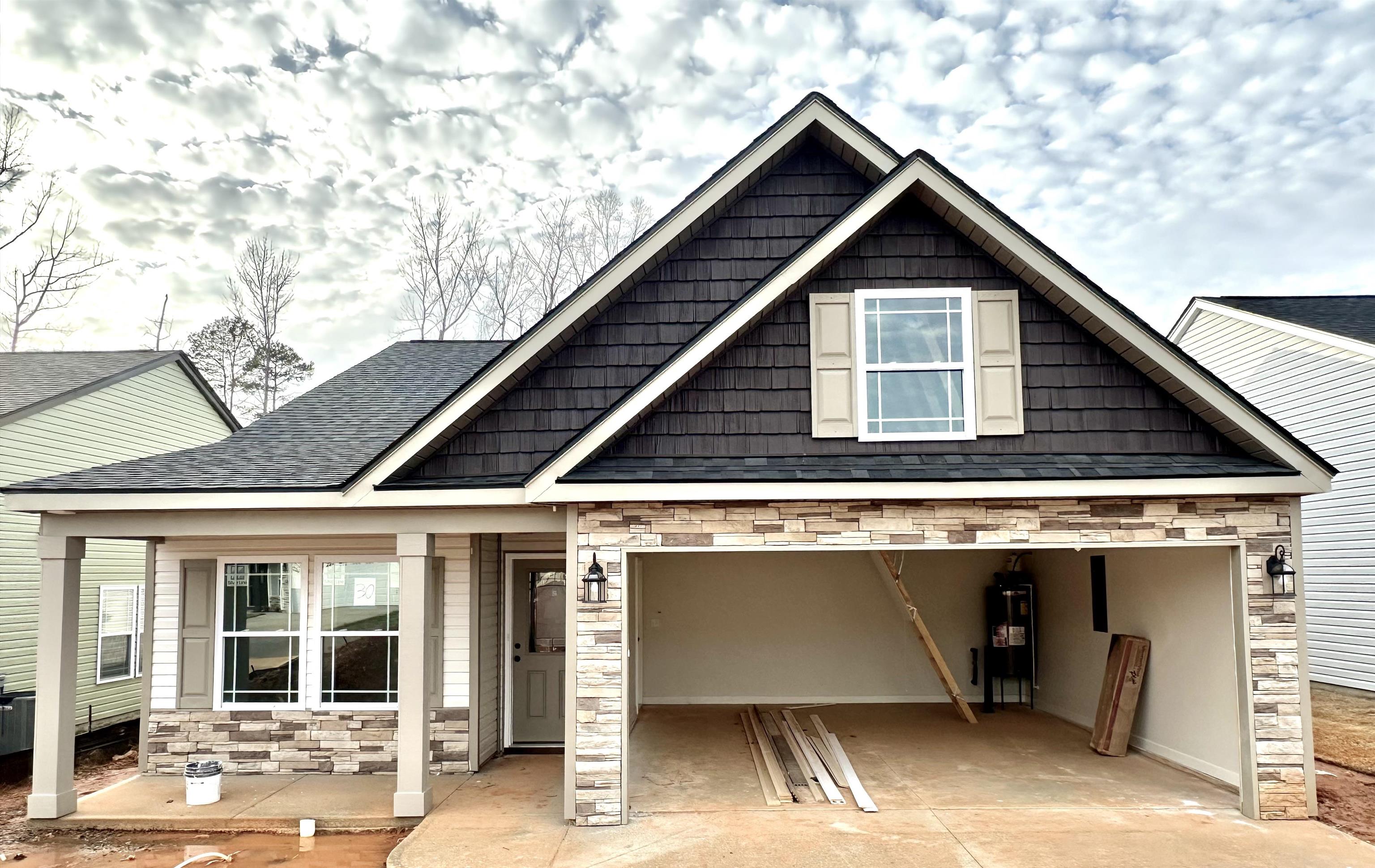 The BISHOP plan (Lot 30) has a spacious open living area and study. Granite countertops, crown molding with rope lighting, and many more features included. Master bath upgrade to include double vanity and garden tub in addition to walk-in shower.  12' X 12' Covered patio overlooks the private yard.  30-year architectural shingles, site-built construction, and a 10 year limited warranty are included to give you peace of mind.  $7500 Closing cost or upgrades incentives available when working with a preferred lender and attorney!!   *Virtual tour reflects same house plan, not exact house.