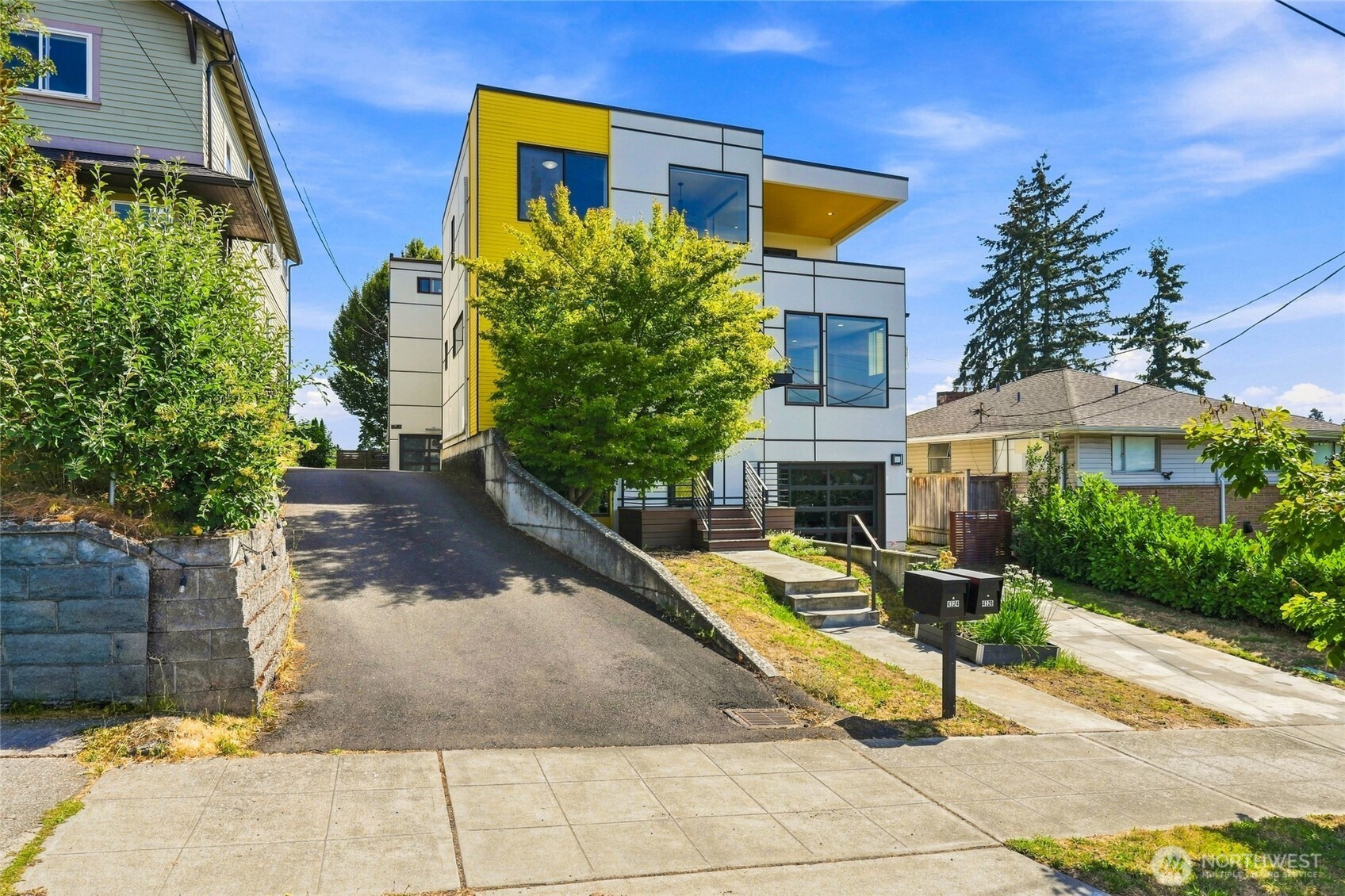 Come home to light, warmth & a lifestyle that feels distinctly Seattle. This beautifully designed modern home offers inviting open-concept living where the kitchen, dining & gathering spaces flow together effortlessly—perfect for relaxed evenings or entertaining friends. Warm bamboo floors & abundant natural light create a comfortable, welcoming feel throughout. Upstairs, the primary suite becomes your own peaceful retreat with a walk-in closet & private deck—an ideal spot for morning coffee, quiet evenings or simply taking in the view. Additional bedrooms & a versatile bonus room provide space for guests, work, hobbies or everyday life. Step outside to enjoy the fenced patio & multiple outdoor spaces designed for relaxing & reconnecting. Thoughtful design, wonderful indoor-outdoor living & a location that lets you enjoy everything Seattle has to offer. This isn't just a home to see—it's a home where you will want to stay awhile.