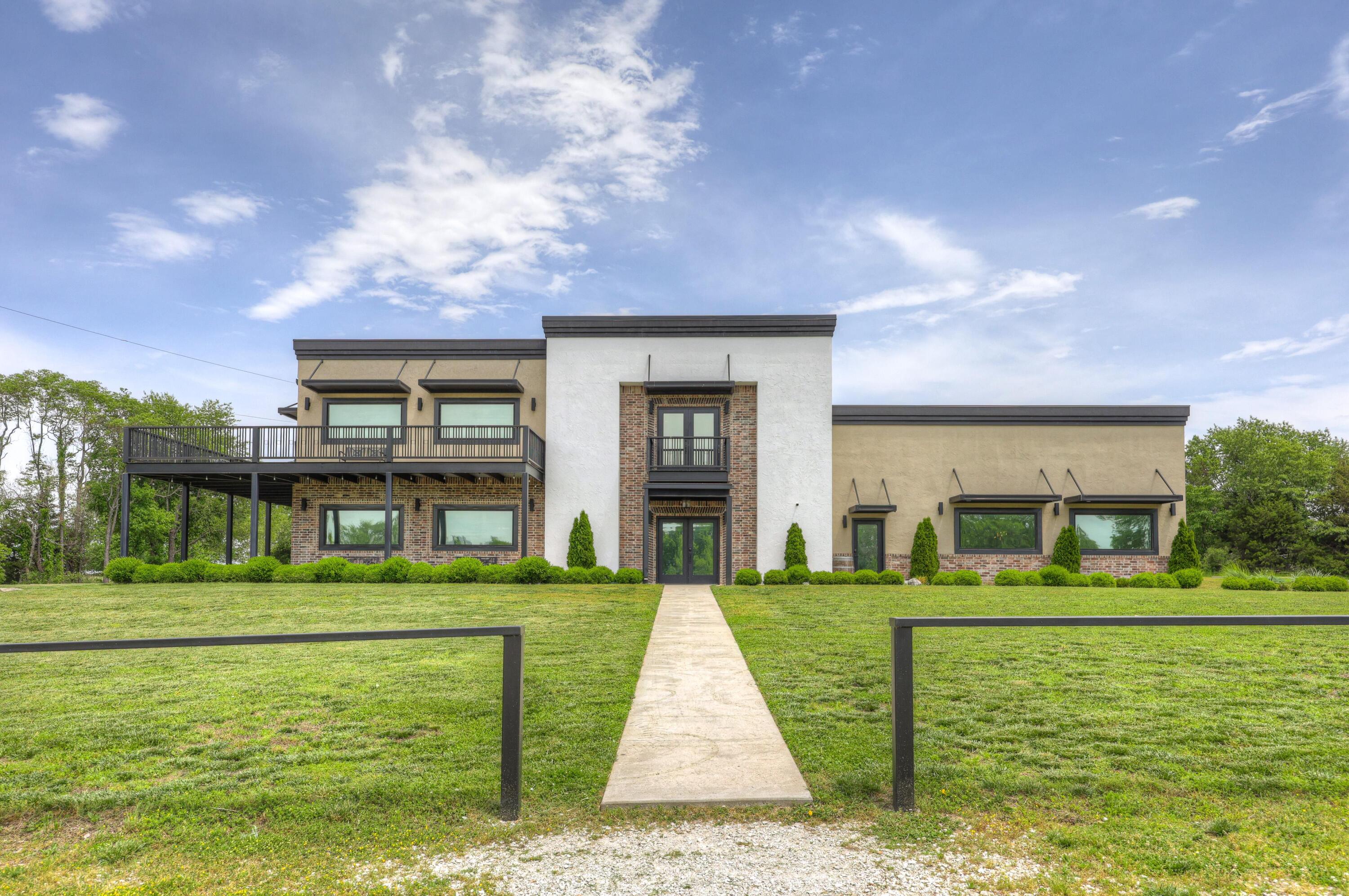 Now is your chance to own The Emerald Event Centers, an incredible property with beautiful and unique venues, situated on over 42 acres. Amazing income potential on this property with 3 event centers, including: The Silver Spoon Barn, featuring 8,500 square feet with 6 restrooms, separate kitchen area, bride and groom suites, and room for 500 guests. The Sterling, a modern industrial event space with 8,500 square feet, 5 restrooms, kitchen area, bride and groom suites, and accommodations for 400. Finally, The Platinum Pavilion, a rustic themed event center with silo and covered outdoor area with 5 restrooms, full kitchen, and room for 150 of your guests. Also included are 2 additional outdoor pavilions, storage, garage for equipment, and 3 ponds. All of this situated on 42 beautiful acres close to town with convenient access to I-49 and I-44. Only an hour from Northwest Arkansas and about 2 hours from Tulsa or Kansas City. Come make your dreams, and the dreams of all your event clients, come true!