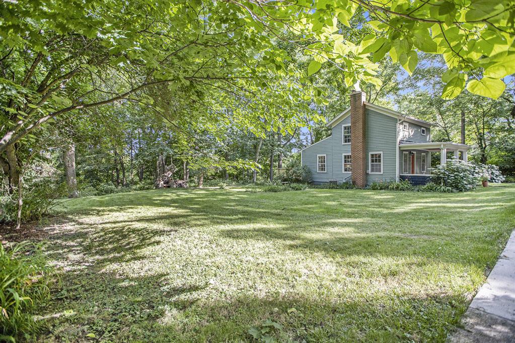 What an Opportunity!  Buildable lot in a great, walkable, tree-lined neighborhood: coffee/bar, restaurants, groceries, Downtown, Kerrytown, farmer's market, Hospitals, UM Campuses, train & bus lines, Huron River parks, trails, biking, canoeing & kayaking.  Lovely views of downtown lights at night and woods in the day. Lot includes a charming, historic & updated 964 sq ft cottage w/2 bedrooms, cook's kitchen & 2 full baths, maple floors, deck and big front porch.  Live in or rent out the cottage while you build.  Cottage also makes a great home office, studio, in-law or guest space or rental.  This lot has easy street and utility access, flat terrain and no large trees to clear for easy building.  Concept drawings in listing are by architect H. Scott Diels and this or something comparable by him, or by your own architect could be built here. Home Energy Score 6. Full report: stream.a2gov.org . Property taxes currently are NON-homestead.