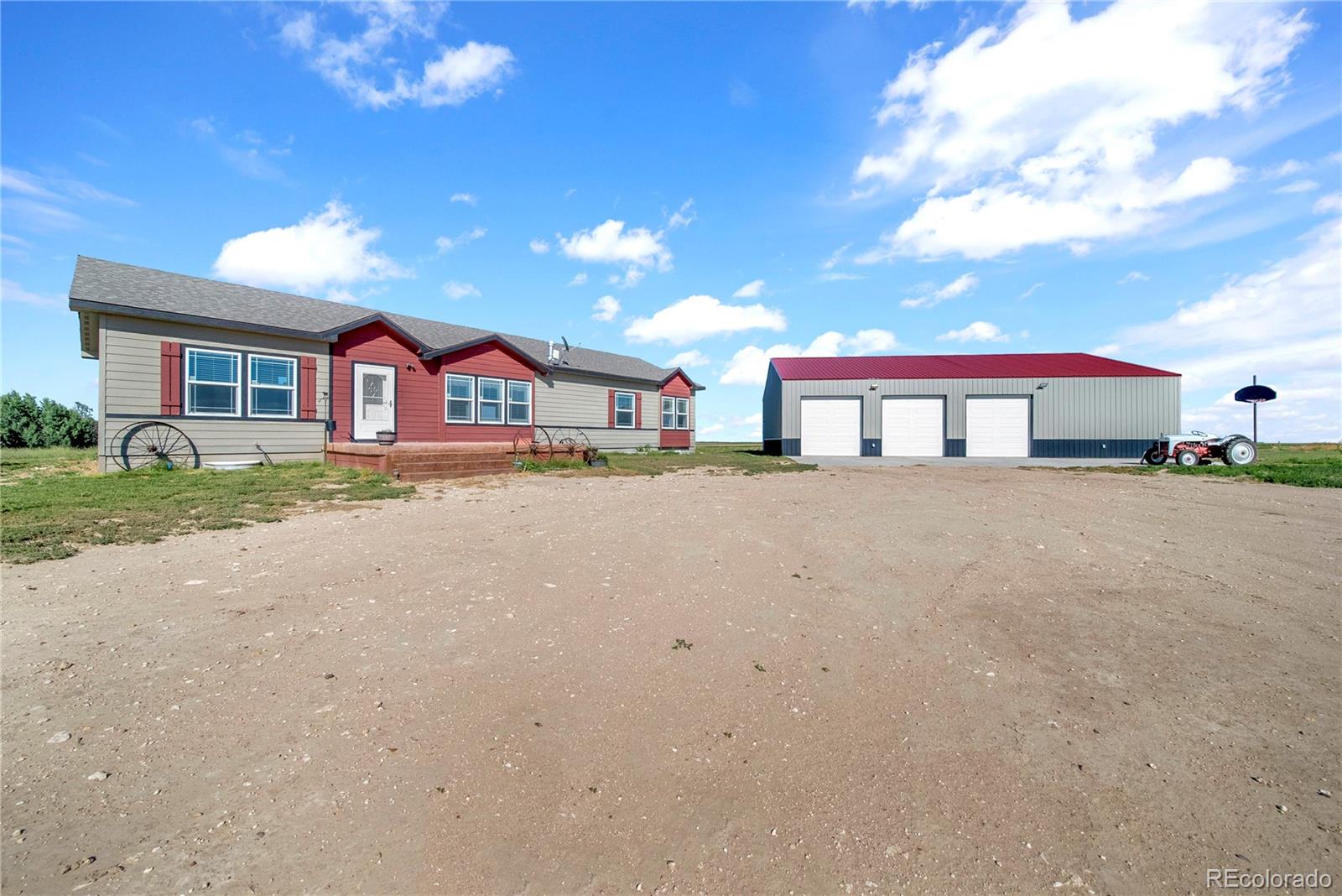 An Acreage Delight with Reduced Price. This motivated sell has a Move-In-Ready Newer home plus a new 42" x 60' Cleary Shop/Garage building, including another shop, barn and corrals all on 40 spacious acres with mature trees and windbreak, wildlife and beautiful country views.  This home features 3 bedrooms 2 full bathrooms, a huge kitchen which has a commercial size refrigerator and open floor plan. the large master bedroom suite comes with its own walk in closet and large 5-piece bathroom. It has a full unfinished basement with a walk-in vault/safe room and pellet stove. It has 2 outer buildings for livestock and corrals.