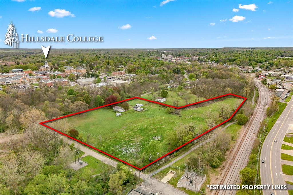 RARE 9-acre development opportunity located within the City of Hillsdale, bordering Hillsdale College and just steps from the new Hillsdale College hotel development. This prime parcel offers over 1,000 feet of road frontage on two roads, providing excellent accessibility and significant future development potential. The property includes a 3-bedroom, 2-bath home, a 22x38 utility building, a 30x24  heated barn, and an additional utility shed. Ideal for investors, developers, or those seeking a large parcel in a highly desirable and growing area. Investments may be subject to city approval. County records used for included information. Buyers should verify all information independently. Call the listing agent for more details or to schedule a showing.