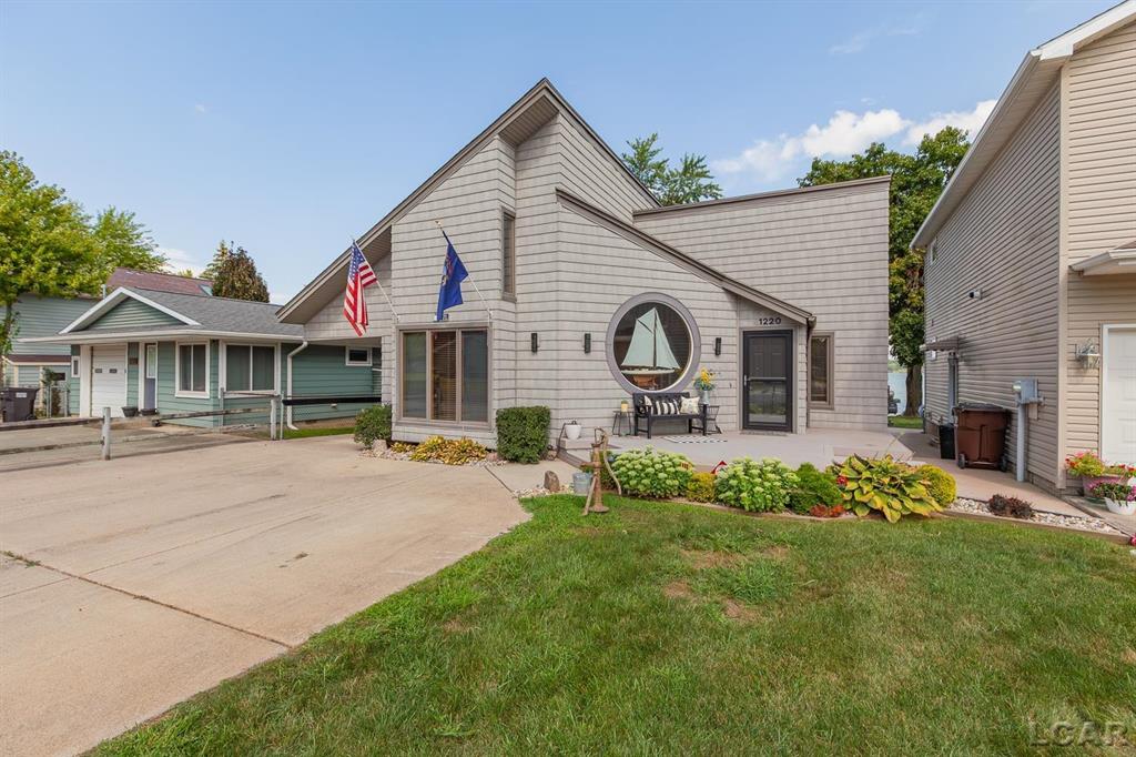 Beautiful Round Lake home.  This 3 bedroom 2 bathroom home offers unique features, sandy beach, lots of light and is move in ready.  The main floor primary bedroom has a walk in closet, and full bathroom.  2 large bedrooms on the second floor, a large outside patio on the water, a large carport for all the storage you need.  Full in home generator included.  Call today for a private showing.