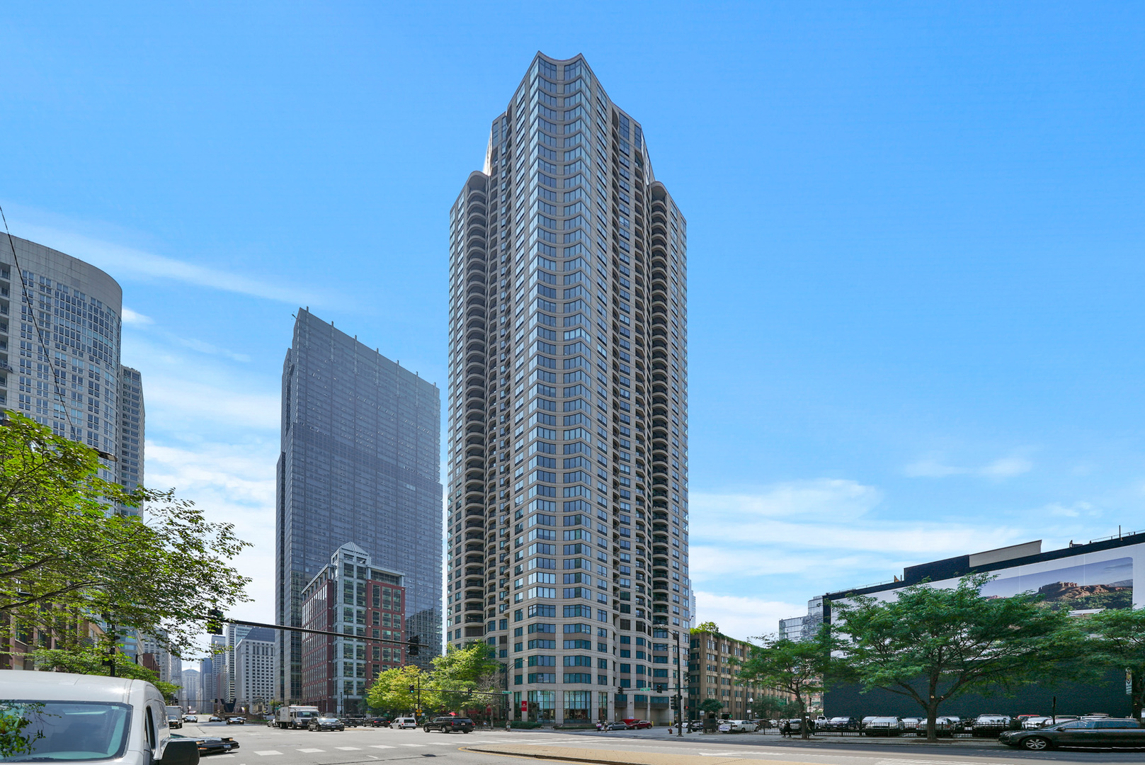 Every window in this bright 2 bed, 1.1 bath condo faces south, flooding the space with natural light! Enjoy a rare opportunity to own in the preferred tier of a professionally managed, full-amenity luxury building in River North. The spacious kitchen features ample cabinetry, stainless steel appliances, and granite countertops. The open-concept living area flows out to a private, covered balcony-perfect for entertaining or relaxing while taking in the sunset. The primary bedroom includes a large walk-in closet and an en-suite bath, while the second bedroom is ideal for a home office or guest bedroom. Recent updates (June 2025) include new dishwasher, entire unit professionally painted, kitchen cabinets refreshed, and brand new LVP flooring throughout. Additional features include in-unit laundry and parking available in the building for lease. The full-service building offers 24-hour door staff, dry cleaners, a large landscaped terrace with BBQ area and pool, a fitness center, and a party room. Unbeatable location-walk to top restaurants, shops, parks, public transportation, and more. Pet-friendly, investor-friendly, and no rental cap! Take a 3D Tour-click the 3D button to explore the space virtually! Watch the custom drone video-click the Video button!