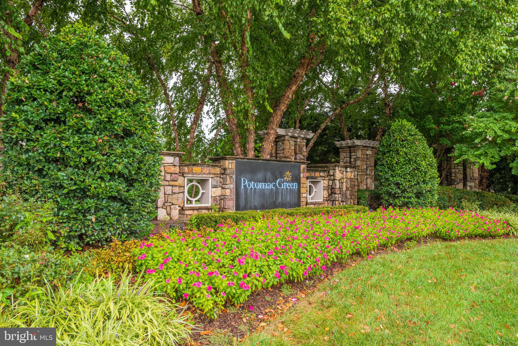 Nestled within the serene and vibrant Potomac Green community, this exquisite 2-bedroom, 2-bathroom condominium offers an unparalleled lifestyle tailored for those seeking comfort and luxury. Step inside to discover a thoughtfully designed open floor plan that seamlessly connects the gourmet kitchen, dining area, and family room. The kitchen is a culinary delight, featuring upgraded countertops and high-end stainless steel appliances, including a built-in microwave, gas range, and dishwasher. Whether you're preparing a casual meal or entertaining guests, this space is sure to impress. The interior boasts luxurious finishes, including plush carpeting and rich wood flooring, complemented by crown moldings and chair railings that add a touch of sophistication. The primary suite is a true retreat, complete with a spacious walk-in closet and an en-suite bathroom featuring both a soaking tub and a walk-in shower, perfect for unwinding after a long day. Additional features include built-ins for added storage, ceiling fans for comfort, and elegant window treatments that enhance the home's charm. The refrigerator and hot water heater are new items. Outside, the Potomac Green community offers a wealth of amenities designed to enrich your lifestyle. Enjoy leisurely afternoons at the indoor and outdoor pools, or stay active in the  state-of-the-art fitness center and on the pickleball courts. The clubhouse serves as a hub for social gatherings, while the library and game room provide spaces for relaxation and entertainment. With beautifully landscaped common grounds, walking paths, and picnic areas, every day feels like a vacation. This condominium also includes the convenience of an attached garage with inside access, ensuring easy entry and additional storage. The community is gated, providing peace of mind, while the association fee covers essential services such as lawn maintenance, security, and trash removal, allowing you to focus on enjoying life. With its prime location just minutes from local amenities and transportation options, this home is not just a residence; it's a gateway to an exclusive lifestyle filled with comfort, community, and luxury. Experience the best of senior living in this exceptional Potomac Green condominium, where every detail has been crafted for your enjoyment.