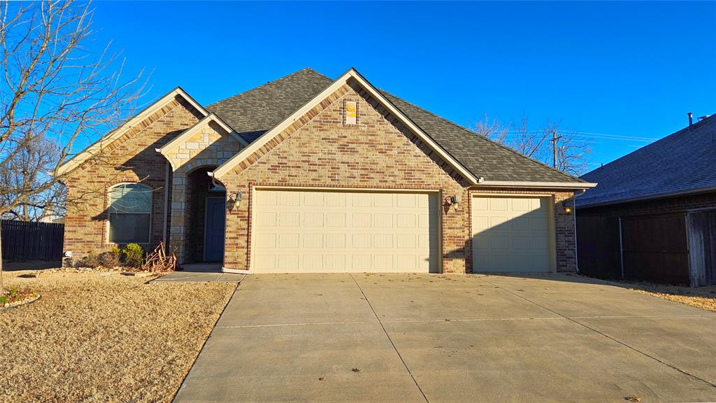 Situated in the gated Kimberly Crossing neighborhood of Edmond, this inviting home offers three bedrooms, two full bathrooms, along with a flexible extra room ideal for an office or study. The community is known for its welcoming atmosphere and convenient location. The central living space connects easily to the kitchen, creating a comfortable layout for daily living and gatherings. The kitchen features stone countertops, maple-toned cabinetry, generous storage, and a convenient bar-height seating area. A gas range, refrigerator, and dishwasher are included. Just off the kitchen is a casual dining area perfect for everyday meals. Soft, neutral finishes carry throughout the home. All bedrooms have carpeted flooring, while the bonus room includes wood floors. A fireplace anchors the living area and adds a cozy touch. The primary suite includes a spacious bathroom and an oversized walk-in closet. Storage is abundant throughout the home with multiple closets. Additional highlights include a dedicated laundry room and a three-car garage. Come see this beauty for yourself today!