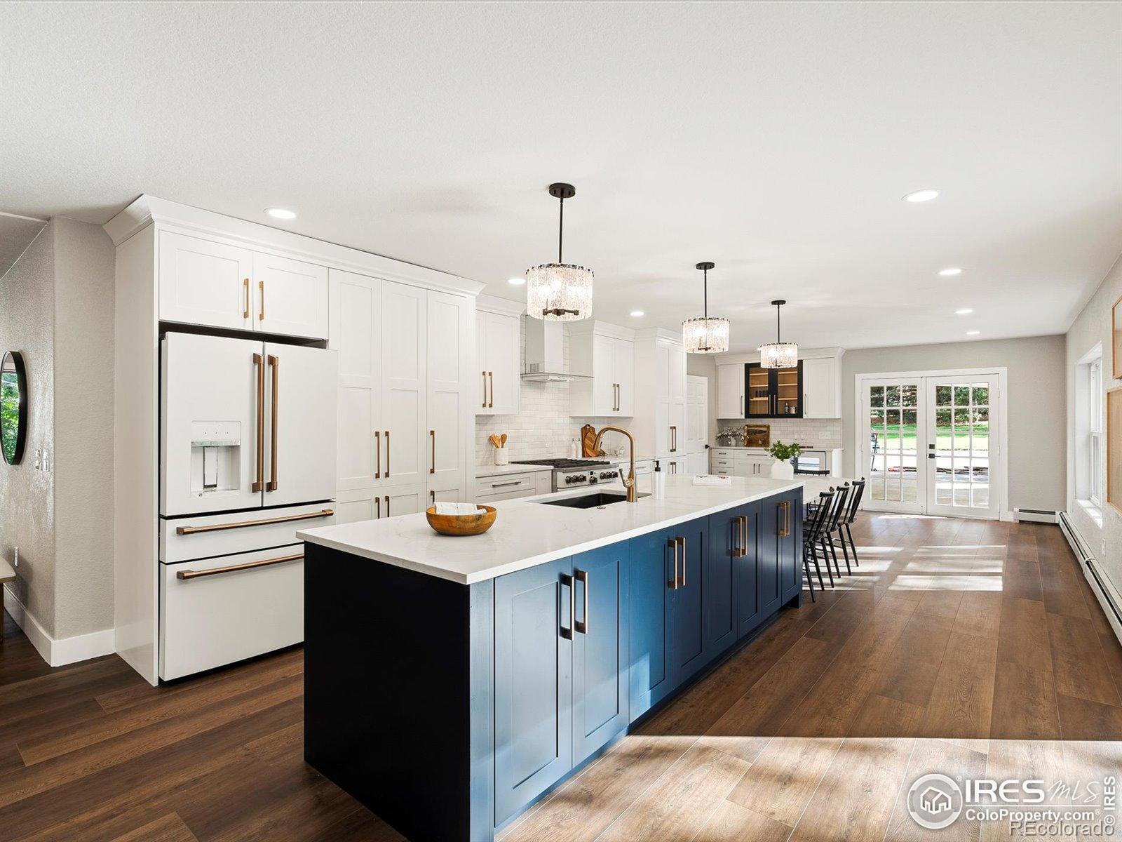 University Hills / Park-front location / Remodeled home / Rooftop deck / Expanded kitchen / Open-concept layout / Extensive system upgrades / Located directly across from Eisenhower Park, this thoughtfully remodeled South Denver residence features an open-concept layout with flexible living spaces across two levels. The expanded eat-in kitchen offers quartz countertops, custom cabinetry, premium appliances, and a hidden walk-in pantry, with sliding doors opening to a landscaped backyard with dual patios, including a covered patio with gas line for grilling. The main level includes a formal dining room with coffered ceiling, updated flooring and windows, two bedrooms, a full bath, and a mudroom with laundry. The living room is anchored by an electric fireplace with custom stone surround. Upstairs, a flexible loft offers space ideal for a home office, fitness area, or bonus room. The primary suite features dual sinks, quartzite surfaces, a freestanding soaking tub, an oversized walk-in shower, a custom closet by Closets by Design, and direct access to a south-facing Trex rooftop deck overlooking the park. An additional upstairs bedroom includes a private bathroom and walk-in closet. Recent improvements include a new roof, gutters, fascia, soffits, wood siding, Trex decking with metal railings, fresh interior and exterior paint, updated plumbing fixtures, new hot water heater, three mini-split HVAC systems, attic fan, updated lighting, refreshed concrete, professional landscaping with drip irrigation, and gas service at the covered patio. Proximity: adjacent to Eisenhower Park, Rec Center, and pickleball courts; ~0.5 mi to High Line Canal Trail; ~1.0 mi to Wellshire Golf Course; ~0.5-0.75 mi to shopping and dining along Hampden Ave and Colorado Blvd.