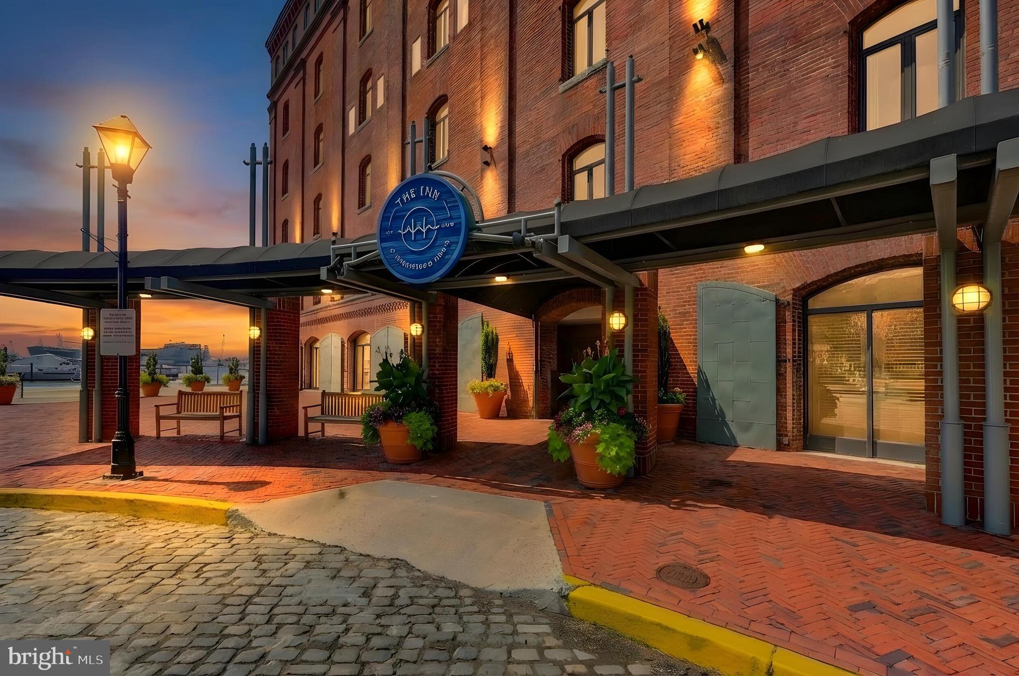 Set along the cobblestone streets of historic Fells Point, 1000 Fell Street #418 offers a distinctive blend of waterfront living, historic character, and modern comfort within the sought-after Henderson’s Wharf. This beautifully updated single-level, two-bedroom, two-bath corner condominium enjoys water views from all of the main living areas, creating a wonderful connection to Baltimore’s waterfront.The spacious living and dining areas feature rich hardwood flooring, exposed brick walls, and abundant natural light, providing an inviting backdrop for both everyday living and entertaining. The corner setting offers an exceptional sense of openness, with water views enjoyed from the principal living spaces. The updated kitchen complements the home’s historic character while providing the conveniences expected for today’s lifestyle.The two bedrooms are privately positioned and finished with carpeting for comfort, while two full baths offer convenience for residents and guests. Throughout the residence, the combination of exposed brick, hardwood floors, generous windows, and waterfront vistas creates the distinctive loft-like character that makes Henderson’s Wharf so desirable.Beyond the residence, enjoy the best of Fells Point just outside your door—cobblestone streets, waterfront promenades, acclaimed restaurants, neighborhood shops, and the vibrant energy of one of Baltimore’s most historic communities. A rare corner residence offering single-level living, two bedrooms, two baths, and water views throughout the main living spaces, all in the heart of historic Fells Point.