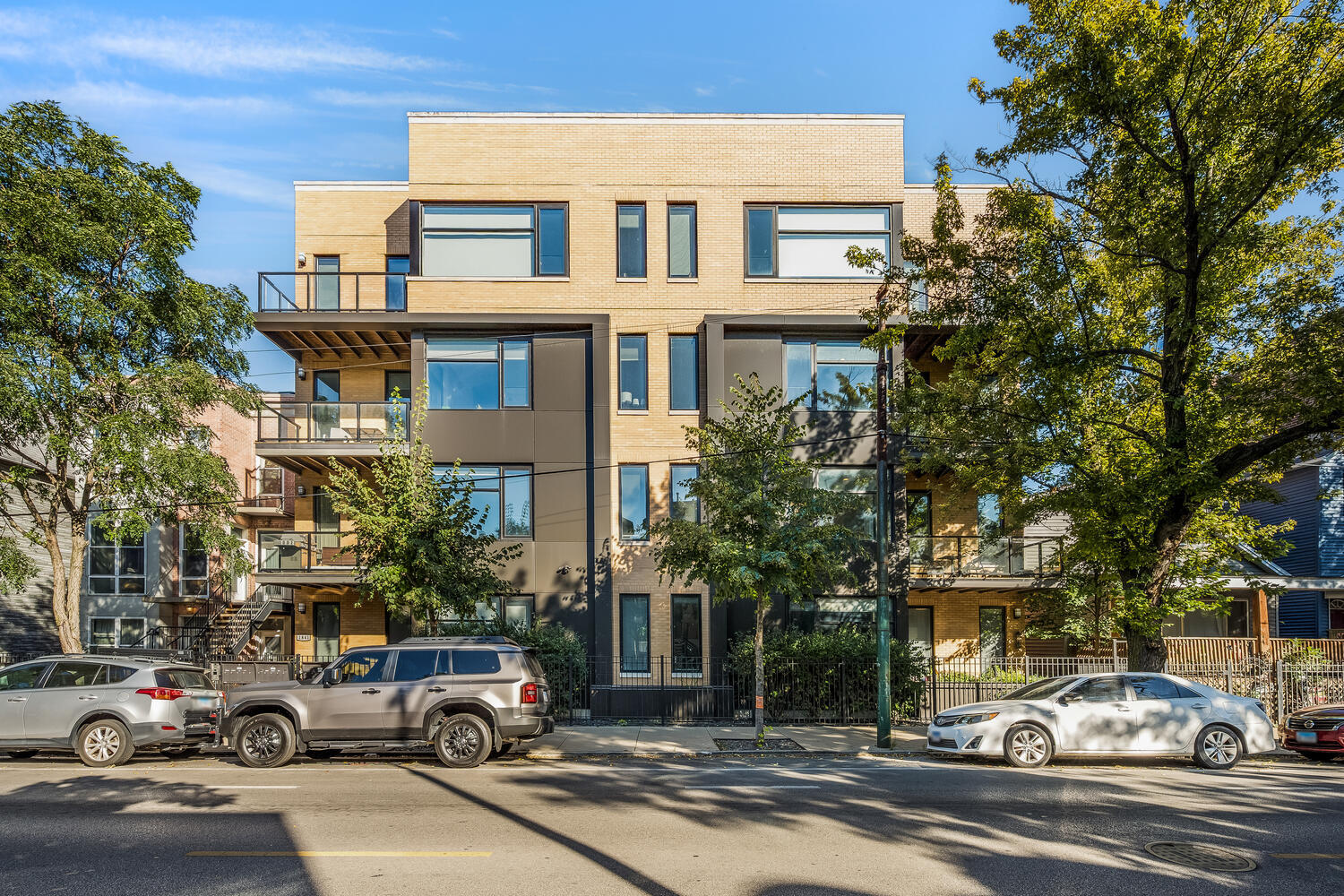 Welcome to The Palmer, a boutique, newer-construction elevator building perfectly situated in the heart of Logan Square. This bright 3-bedroom, 2-bath corner residence blends modern design, high end finishes, and unbeatable walkability; walking distance from two Blue Line stops, neighborhood parks, and top-rated schools.    This south west corner unit is flooded with natural light. The open-concept living space is anchored by a chef's kitchen with white quartz countertops, a waterfall island, premium stainless steel appliances, and a pantry closet. Beautiful hardwood floors run throughout, leading to a spacious primary suite complete with a walk-in closet, custom built-out storage throughout and a spa-like bath featuring radiant heated floors.    Additional highlights include in-unit laundry, a private balcony, and an expansive private rooftop deck with incredible skyline view. The home also comes with heated garage parking and a rare dedicated dog run for pet owners.    With the 606 Trail and Logan Square's acclaimed dining, coffee shops, and nightlife just outside your door, this residence offers a vibrant urban lifestyle.