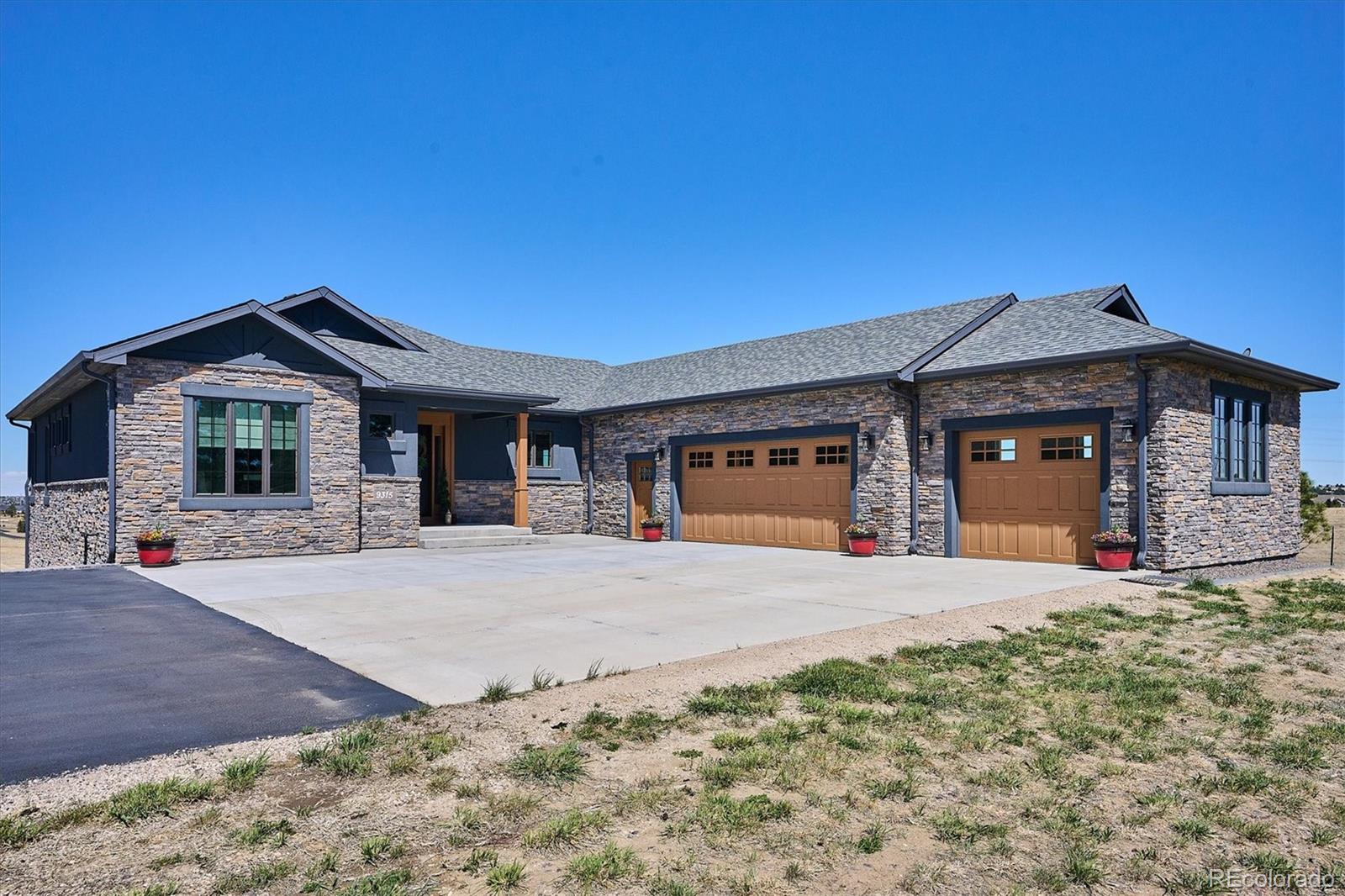 LOCATION! Location! Location! Minutes from Downtown Parker & E-470.Don't miss this coveted custom engineered stone & stucco built Ranch with fully finished Walk-out Basement on 10.16 Acres all set up for your livestock needs with 20 acre adjacent parcel available for sale.The entrance sets the tone for a home that is rich in detail & luxury. The heart of this home is its open concept main level where wood plank floors span the space with natural light and elevated by  impeccable craftsmanship & attention to detail throughout. The Great Room features vaulted ceilings, a cozy gas fireplace, & expansive windows. The chefs gourmet kitchen will please the most discriminating. It is a masterpiece of design and functionality, boasting top of the line Kitchen Aid appliances with dual fuel range gas cooktop & electric oven, also a built in oven & microwave. Featuring  oversized Quartz island with plenty of cabinets & a large walk-in pantry. The primary suite is a sanctuary of tranquility with coffered ceilings, coffee/beverage center, five piece bath with free standing soaker tub, walk in shower, & walk in closet.  The main floor dedicated office is perfect for remote work or a creative escape. The fully finished walk-out lower level provides incredible versatility, featuring a spacious family room with gas fireplace, wet bar, Refrigerator & built in cabinets.  3 Extra Large bedrooms all with their own 3/4 baths & walk in closets, 2nd laundry/utility room & a 2 person light therapy sauna. Step outside to the expansive wrap around upper & lower decks totaling 1100 square feet. The 3 car attached garage is oversized, drywalled, finished, heated, flr coated, & insulated. The MECHANICS DREAM is the detached custom built shop which includes 2  12 'X 12', & 1  10' X 10' door with side mount openers. Shop features 2688 Sq. ft. 1/2 bath, refrigerator, cabinets, work bench, heated. Zoned for Domestic livestock. Come see for yourself Colorado living at its finest. Its a way of life.