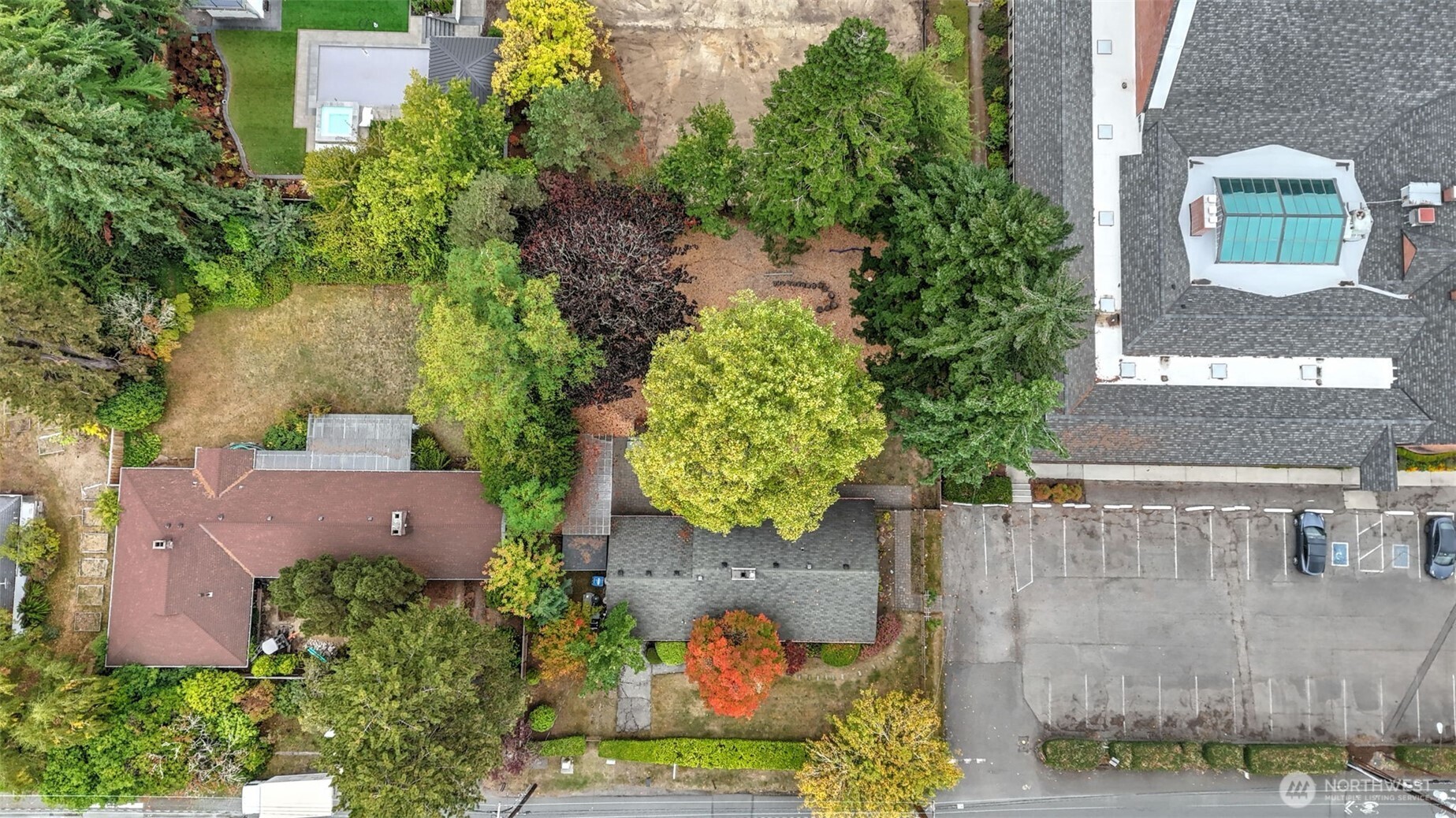 Prime 13,500 sq ft level lot on Mercer Island’s coveted north end! Perfectly oriented for both morning and evening sun, this expansive property offers endless possibilities—build your dream home or reimagine the existing structure to suit your vision. Currently used as a school, the home will need updates to convert back to residential use. Enjoy privacy and convenience near Northwood & West Mercer Elementary, MIHS, Boys & Girls Club, parks, indoor pool, and downtown Mercer Island.  A rare, flat lot with incredible potential—bring your builder and architect! Home is occupied—appointment required to view.