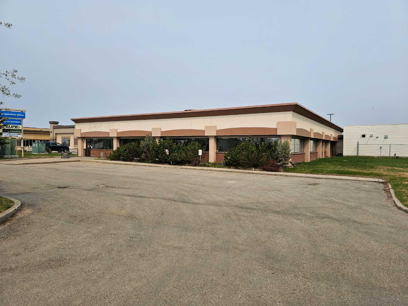 This exceptional commercial opportunity offers +/-10,167sq.ft of office space in a PRIME VISIBILITY LOCATION just off the 116th Ave bypass. The 1.16 Acre lot includes paved parking in front of the building along with a large fenced rear yard, with powered parking stalls and ready for a multitude of uses. The main building is loaded with +/-20 offices, large reception area, boardroom, staffroom, two washrooms and extra open office areas. There is a 30x35 lab (2009) w/ sump & 1-12W x 8H OH door on the East side of the property that could be used as a shop or garage, as well as a large undeveloped area that could easily accommodate an expansion of the main building. Contact your Commercial REALTOR® today for more information! List agent is related to the seller.