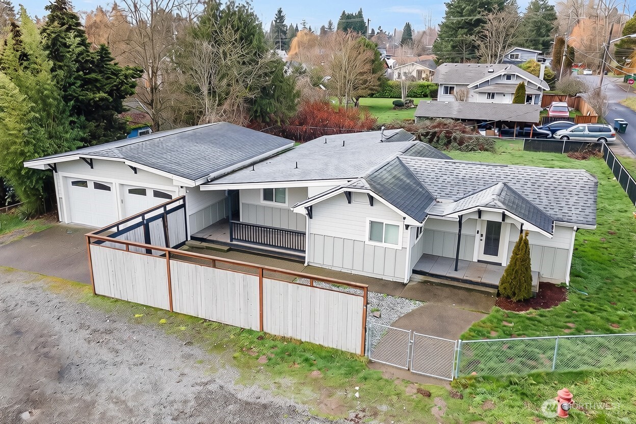 Tucked away in a peaceful, private neighborhood, this inviting rambler offers the perfect blend of comfort, space, and convenience. Step inside to an open, light-filled interior featuring laminate hardwood flooring, and vaulted ceilings in some areas that create a bright and spacious feel. The kitchen serves as the heart of the home with a large breakfast bar, wall oven, generous cabinet space, and plenty of room to gather. Well-sized bedrooms provide comfortable living throughout, while the attached 2-car garage adds everyday convenience. Step outside and imagine the possibilities. The expansive, fully fenced backyard offers plenty of room for summer barbecues, a firepit and outdoor seating area, garden beds, play space, or simply a private place to unwind at the end of the day. Whether you're hosting friends or enjoying a quiet evening at home, there’s space to make this backyard your own. Conveniently located near schools, restaurants, public transportation, parks, trails, and everyday amenities, this home brings together privacy, functionality, and location. A home with room to live, gather, and make your own. Come see the possibilities for yourself!