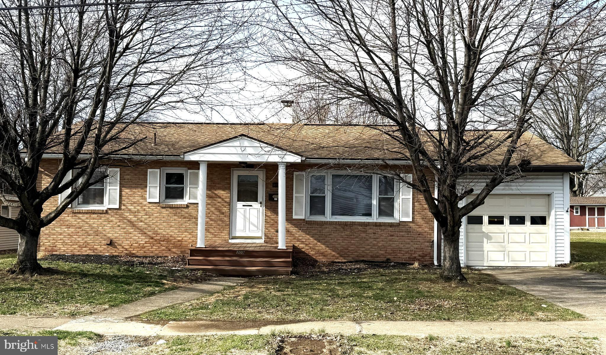 This conveniently located ranch style home in Mechanicsburg offers 3 bedrooms, a large living room and an eat-in kitchen.  Additional features include hardwood flooring, economical natural gas heat, central air conditioning, a full, unfinished basement with a washing machine and clothes dryer, an oversized attached one-car garage and an enclosed rear porch or sunroom.  The larger back yard has a fenced in area with a small shed that could be ideal for pets