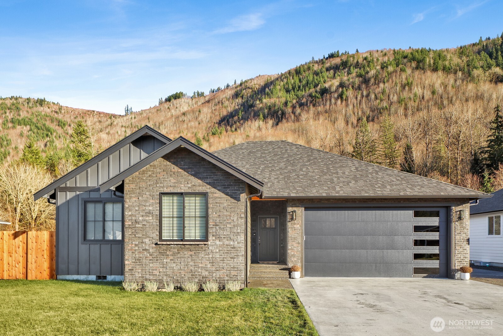 Experience refined living in this exceptional home! designed with elegance, comfort, and quality craftsmanship throughout with breath taking views.Chef-inspired kitchen showcases white shaker cabinetry, quartz counters, and high-end finishes w/ under cabinet & toe kick lighting. Radiant heated floors in bath /laundry with custom tile work provide comfort. Large Primary bath with custom shelving. Interior walls insulated for noise reduction. Thick waterproof flooring throughout.Fully insulated & heated 3 car garage elevates functionality with an epoxy-finished floor and generous storage, ideal for vehicles or hobbies. Welder hookup, electric car charger and sink. Insulated garage door 18x9 allowing for larger vehicles. Outdoors the property features: Custom stone work, large covered deck, lawn sprinkler system, hot/cold water faucets, Fully fenced in yard, additional poured concrete for expanded parking, an RV and sauna hookup, and a private hot tub, offering the perfect blend of relaxation and convenience. Thoughtfully designed and impeccably finished, this home combines modern luxury with everyday practicality—an exceptional opportunity to own a turn-key residence with premium upgrades and space to accommodate every lifestyle. Close to Mount Baker, Silver lake.