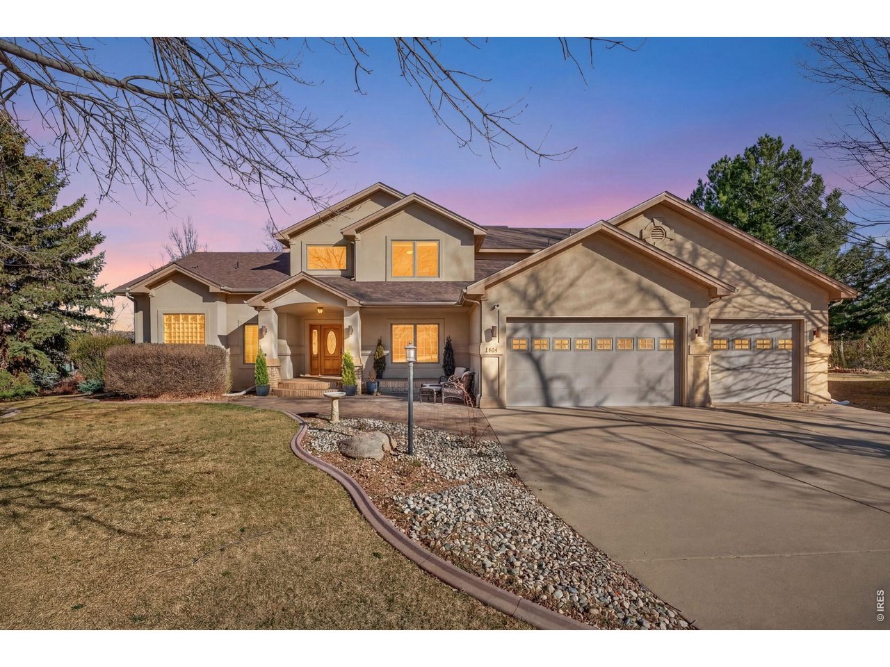 Welcome to the highly desirable Lakeside Terrace community in Loveland, where comfort, space, and thoughtful upgrades come together in this beautiful home at 2463 Amber Drive. With over $80,000 in upgrades and nearly 5,000 square feet of living space, this spacious home offers 5 bedrooms plus a dedicated office, ideal for multi-generational living, working from home, or hosting guests.Step inside to a bright, open floor plan featuring soaring ceilings, abundant natural light, and a cozy gas fireplace in the main living area. The main-floor primary suite offers a private retreat with generous space and comfort. The large eat-in kitchen is designed for everyday living and entertaining, complete with a spacious dining area and custom-built coffee bar. The main level also includes a formal dining room or optional office, guest bathroom, and oversized laundry room. Upstairs, you'll find three additional bedrooms and a versatile loft-perfect for a playroom, home office, or secondary living space. The finished garden-level basement offers incredible flexibility with a custom-built ninja gym, cozy lounge with new fireplace, additional bedroom, office, full bathroom, and a rare second kitchen with washer and dryer-creating an ideal in-law suite or private guest quarters. Situated on a rare 1/4 acre lot backing to HOA-maintained green space, the home offers extra privacy and an expanded backyard feel without the maintenance. Additional highlights include a spacious 3-car attached garage and access to Lakeside Terrace amenities, including a community pool, park, tennis courts, and walking trails with a low annual HOA. Outdoor enthusiasts will appreciate the proximity to Ryan Gulch Reservoir, nearby ponds, and miles of trails, while everyday conveniences like King Soopers are just minutes away. This beautifully upgraded Loveland home offers the perfect combination of space, location, and lifestyle.