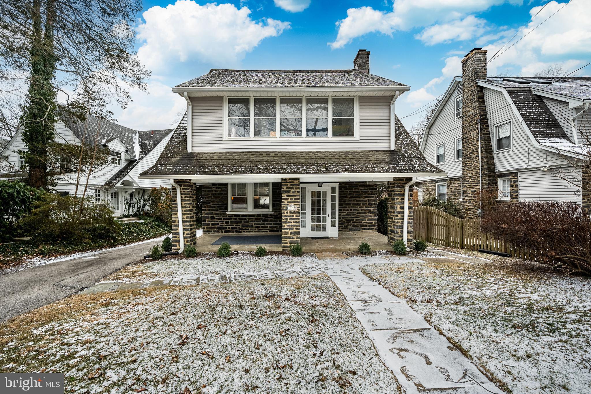 A 1910 classic three-story stone Colonial in sought-after Narberth Borough, this detached, character-rich home has been meticulously maintained and thoughtfully enjoyed. A generous covered stone front porch welcomes you in, setting the tone for a home that feels connected to both its history and its community.Enter through the glass-enclosed front vestibule to reveal a layout that’s both comfortable today and full of potential for the next chapter. Just beyond, a charming fireplace nook - anchored by a stone fireplace and flanked by built-in benches - creates a cozy, storybook moment at the heart of the home. To the left, a welcoming living room flows seamlessly into the dining room, creating a connected yet defined space ideal for both everyday living and entertaining.Hardwood floors guide you through the main living areas, reinforcing the home’s easy, natural flow. The dining room and kitchen are closely connected, making gatherings feel effortless, whether it’s a casual weeknight dinner or hosting friends and family. The kitchen offers practical function with room to personalize over time and leads to a generous pantry tucked around the corner. Nearby, you’ll also find a powder room and an exterior door that opens directly to the backyard - perfect for bringing the outdoors into daily life.A wide staircase leads to the second floor, where three bedrooms and a full hall bath provide flexibility for a nursery, guest room, home office - or all three. The third floor offers its own private retreat: a spacious bedroom with a dressing area and a full bath featuring a classic clawfoot tub, creating a cozy and private owner’s suite.The basement provides excellent storage along with bonus space potential. Outside, the fully cleared, flat, and fenced-in backyard feels like a true extension of the home - ready for play, gardening, entertaining, or simply relaxing under the open sky. A private driveway adds everyday ease and convenience.Lifestyle and location truly shine here. Sidewalks lead you where you want to go - to local parks, cafés, boutiques, and the beloved farmers’ market - making everyday life feel connected and effortless. Equidistant to both the Ardmore and Narberth train stations on the Paoli/Thorndale Line, the home offers easy eastbound access into Philadelphia and westbound travel along the Main Line, with convenient access to dining, shopping, and cultural amenities throughout the Main Line. But there’s little need to leave Narberth. This “Big Little Town” comes alive through year-round traditions and community events, from the Fourth of July celebration and NarbEarth Day to the NarBark Dog Parade, Music & Arts Festival, Oktoberfest, Halloween Parade, and the Dickens Festival - fostering a genuine sense of belonging that’s hard to replicate.Situated in the award-winning Lower Merion School District, this is a home for those who truly appreciate charm, walkability, and convenience - right in the heart of one of the Main Line’s most desirable towns.