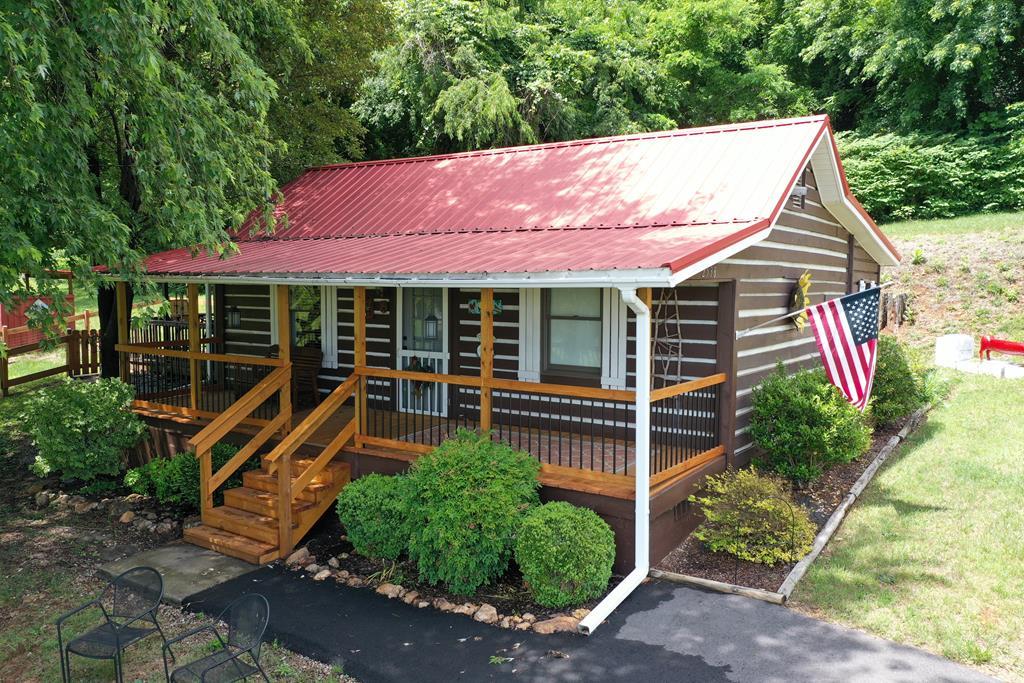 Here is your Rustin Cabin for that weekend get away. Perfect second home or vacation rental, but is equipped for permanent residence.  This two bedroom home offers an updated kitchen with hickory cabinets, a spacious living room and separate dining/breakfast area, and a large updated bathroom with laundry.  Comes furnished and ready to enjoy. Exterior amenities include the covered front porch, an adorable shed that sits just off the screened porch and shaded sitting area.  The beautiful landscaped yard offers perennial flower gardens, mature trees garden area and fruit trees. Pastural and long range views from the property. Paved road frontage and newly paved driveway and parking. A short drive to the Blue Ridge Parkway or the Mayberry NC. Priced to sell and will not last long!
