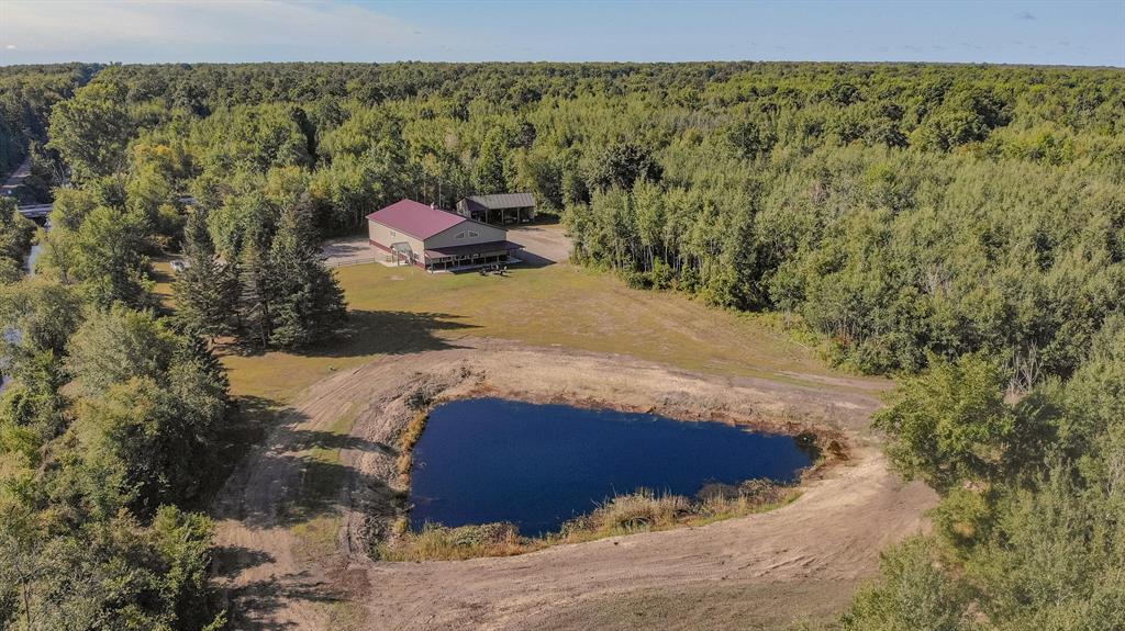 Legacy Hunting & Investment Estate with Lodge on 773.42?? Acres in Central Michigan
This exceptional 773.42?? acre property stands as one of Michigan's legacy estates for hunting, recreation, and investment. Located in Arenac County just 3 miles from Au Gres, This property offers the rare combination of total privacy and proximity to high-class Lake Huron recreation. Owners can enjoy the peace and quiet of their own private land while being close enough to explore boating, fishing, and the many offerings of Michigan's Great Lakes region. Spanning across a diverse landscape, the property features a balanced mix of hardwoods including oaks and maples, thick lowland bedding areas, and open ground with several established food plots. A well-designed trail system and multiple elevated blinds provide seamless access to every corner of the land, creating an environment well-suited for whitetail, turkey, and other game. Generations of management have gone into this property, with a proven history of producing success year after year. 
At the heart of the estate is a 3,600?? square foot barndominium lodge, purpose-built to accommodate large groups. The lodge offers 10 bedrooms, 2 full baths, and a spacious open dining and living area designed for gathering. An attached garage and shop space with dual 16' overhead doors provides functionality for equipment, gear, and vehicles. Beyond hunting and recreation, the lodge has proven rental and investment potential, with a track record of generating income through vacation rentals and gatherings. 
The property is currently enrolled in the Qualified Forest Program (QFP), providing valuable tax benefits while also supporting sustainable forest management and habitat improvement. Two ponds further add to the year-round recreational appeal, offering opportunities for fishing, swimming, or simple relaxation by the water. Whether for private use, corporate retreats, or as an investment-grade holding, this estate represents a rare opportunity to own a large, well-managed property wi
