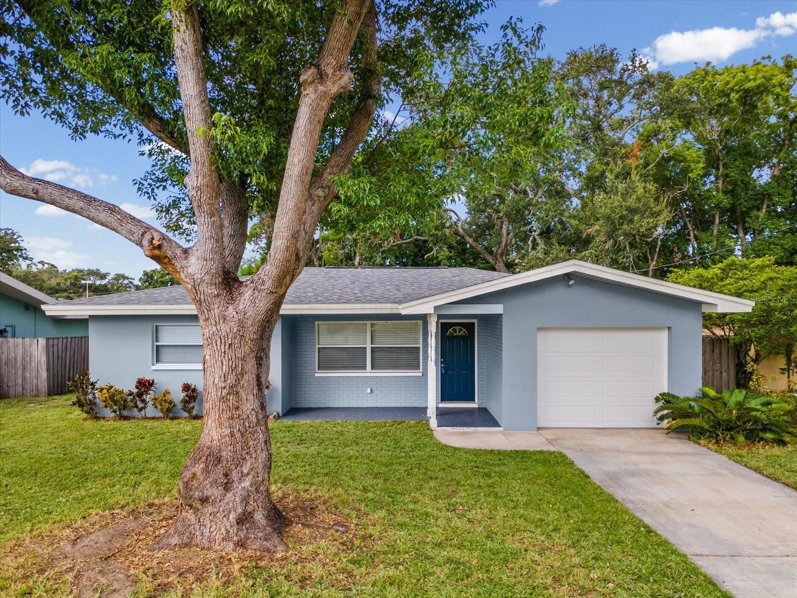 DUNEDIN LIVING AT ITS BEST! Discover the perfect combination of a quiet neighborhood setting and an unbeatable location just minutes from Downtown Dunedin. This beautifully updated 2-bedroom, 2-bath home offers a 1-car garage, a versatile bonus room ideal for a family room, home office, den, or additional living space, and a fully fenced yard (with a shed) for privacy and outdoor enjoyment. Location is everything, and this home puts you close to the best of Dunedin. Spend the day exploring Downtown Dunedin's restaurants, breweries, boutiques, galleries, parks, and entertainment, then head toward the waterfront, Dunedin Causeway, and Honeymoon Island for beautiful Gulf beaches and outdoor adventures. The nearby Pinellas Trail adds even more opportunity for walking and biking. All of this is just minutes from home, while the property itself sits in a peaceful, low-traffic neighborhood. Inside, you'll find NEW luxury vinyl plank flooring, beautifully upgraded bathrooms, crown molding, newer windows, and a NEW water heater installed in 2026. The 2020 roof includes a transferable warranty, offering added peace of mind. The kitchen features stainless steel appliances, including a BRAND NEW refrigerator and range, Interior laundry closet complete with washer and dryer.  The thoughtful updates continue with a water softener, newer electrical outlets and switches, and a freshly painted garage floor. Outside, the fully fenced yard provides a private space for relaxing, entertaining, pets, or enjoying the Florida sunshine. Whether you're looking for a full-time Florida home, a seasonal retreat, or a property close to everything that makes Dunedin special, this home delivers the lifestyle, location, and updates today's buyers are looking for. Move-in ready, beautifully updated, and close to Downtown Dunedin and the Gulf Coast—this is one you won't want to miss!