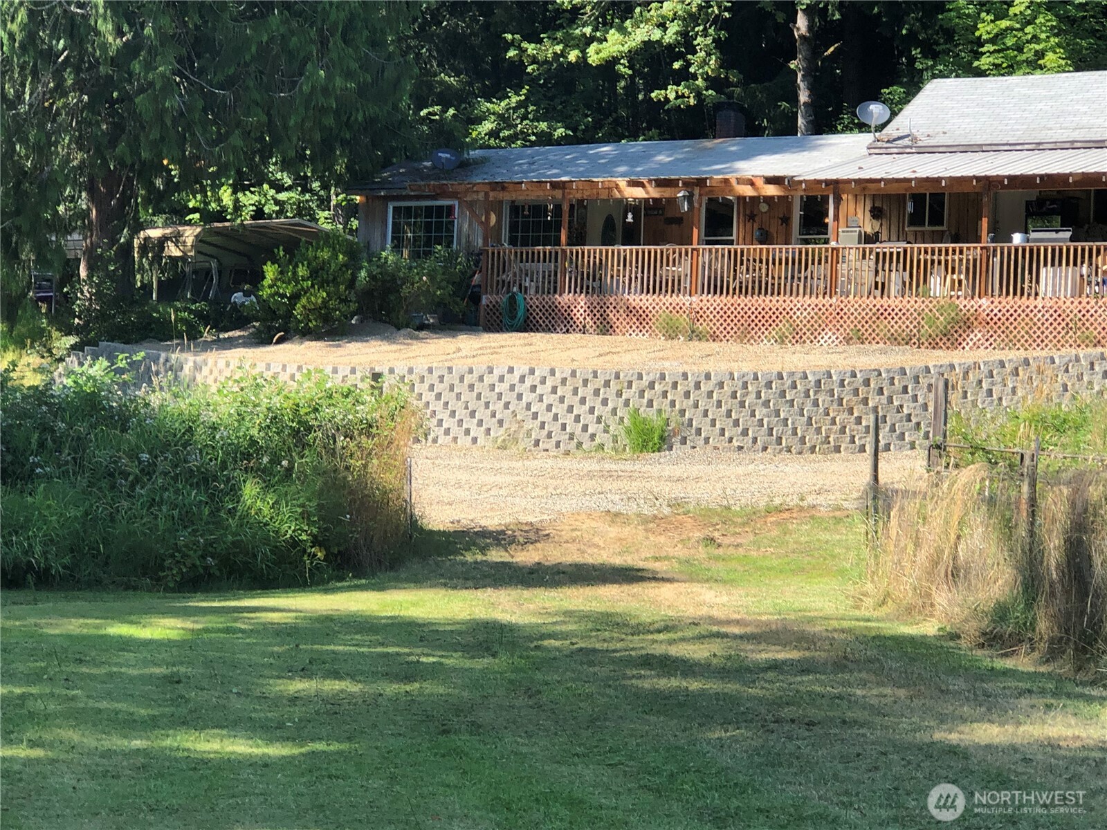 Completely renovated home just off I-5 between PDX & SEA! This 1,700+ sq. ft. home features a new 40-year roof, trusses, kitchen cabinets, quartz countertops, stainless appliances, LVP flooring with carpeted bedrooms, and fresh paint throughout. Includes 3 bedrooms, 1¾ baths, and walk-in closets. Relax on the covered front deck overlooking 19.5 beautiful acres bordered by Salmon Creek on two sides—ideal for agate hunting and fishing. Property includes a pond, garden space, shed barn, larger barn (needs repair), and an orchard with Asian pears, apples, and plums. Private yet convenient—move-in ready with the perfect blend of peace, productivity, and self-sufficiency.