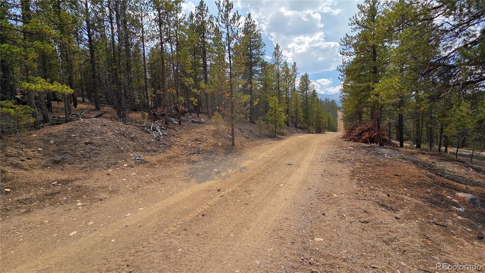 Beautiful mountain lot ready for construction of your new home!   Enjoy the rustling of the trees, the tweeting of the birds, and the solitude that mountain living can give you.   Located moments from fishing, hiking, biking.