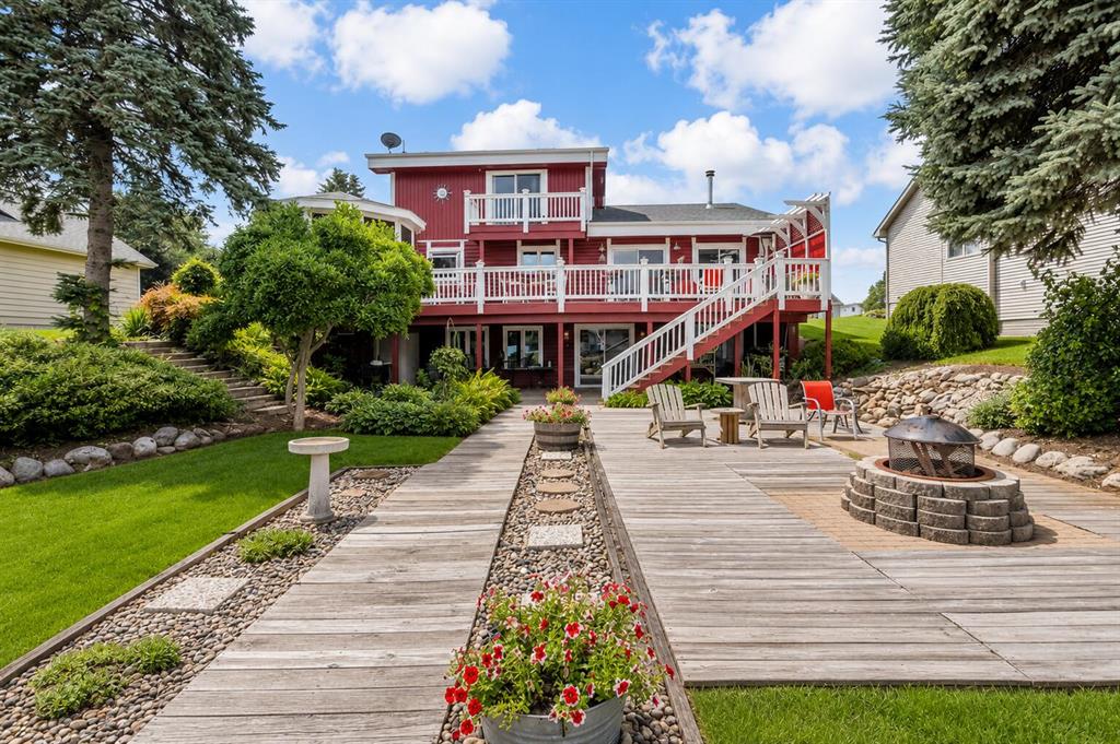 Quality custom built lakefront split level log home. 4,700sqft of living space located on desirable All Sports Loch Erin with 3 bedrooms, 3 full baths a HUGE living room with cathedral ceiling & fireplace. Lakeside kitchen, dining & deck makes this a perfect entertaining space. Custom wet bar, spa with hot tub, sauna & walk in shower. Billiard/rec room with a gas fireplace along with a second living room with wood burning fireplace. Fully heated/cooled workshop area with built in tanning unit. Lakeside Gazebo, gardens & strategically placed flowering plants that bloom through out all the seasons. Huge sun deck waterfront with dual docks making for a highly desirable boat slip. 2.5 car garage. All top quality appliances & so many amenities to mention makes this one a MUST SEE FOR YOURSELF! *Note, this listing does contain side by side REIMAGINED PHOTOS.