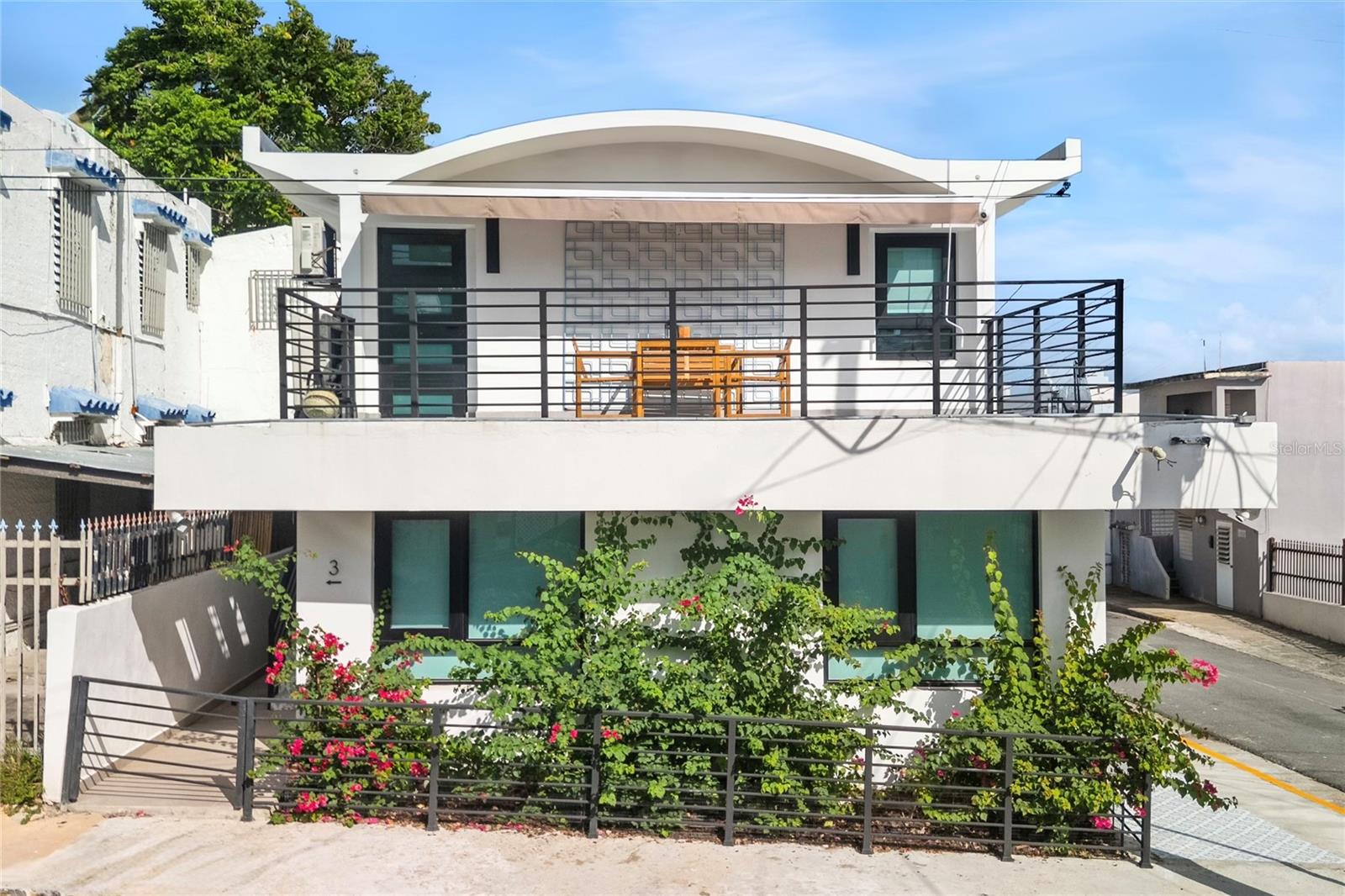 Located at the corner of Calle Pomarrosa and Calle Pabellones in Santurce, this fully furnished 3-unit multifamily property features 4 bedrooms and 3 bathrooms on a 200 square meter corner lot.Santurce is San Juan's largest district and cultural heart, renowned for its street art murals, gastronomy, walkable neighborhoods, and immediate proximity to Ocean Park Beach and Condado.Modern two-story corner multifamily investment opportunity in a prime Santurce location. The ground floor features two independent 1-bedroom, 1-bathroom units. The second floor offers a spacious 2-bedroom, 1-bathroom unit with two private outdoor terraces, an upper-level lounge area, and a dedicated laundry room. The property comes fully furnished with minimalist wood accents, open shelving kitchens, smooth tile flooring, and split AC units throughout. Equipped with a garage, backup electric generator, water cistern, and a single electricity meter.Garage: Yes | Spcs: 1CRIM / Taxes: $1,591.85 (Annually)
