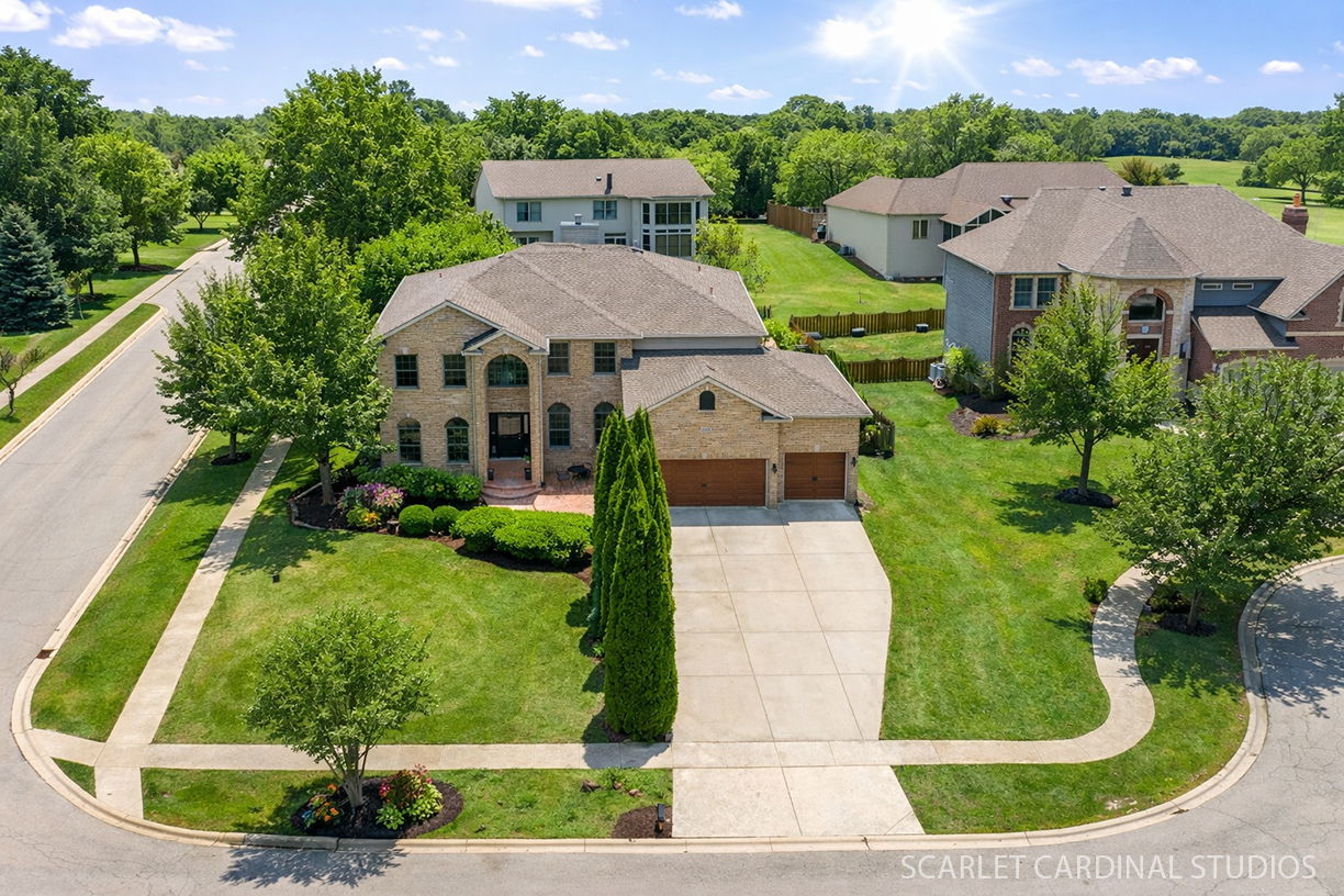3,200 sq ft | Move-in ready | Custom-built Baumgartner home on a quiet cul-de-sac in Deerpath Trails |  If you've been searching for space, natural light, and a home with a true sense of presence-this is one to experience in person!  Set on a quiet cul-de-sac in Deerpath Trails, one of Oswego's most established and sought-after neighborhoods, this custom-built Baumgartner home offers a rare combination of scale, design, and livability. A dramatic two-story entry makes an immediate impression, opening to well-defined living and dining spaces framed by custom decorative columns-creating structure while maintaining an open, connected flow. The main living area is anchored by a soaring two-story family room with stacked windows that fill the space with natural light and highlight the fireplace below. The kitchen and eat-in area connect seamlessly, offering generous space for gathering, everyday living, and entertaining. A center island and adjacent bar/buffet area enhance both function and flow. A main-level bedroom with nearby full bath provides flexibility for guests, related living, or a private home office. Thoughtful everyday features include a spacious mudroom with sink and exterior access, along with both main-level laundry hookups and a second-floor laundry. Upstairs, a generous loft and striking catwalk overlook the family room below, creating a sense of openness and architectural interest that sets this home apart.  Freshly refinished hardwood floors, new carpeting, and updated neutral paint throughout create a clean, move-in-ready backdrop. The deep-pour English basement with plumbing rough-in offers exceptional potential to expand and customize. Outdoor living is equally inviting, with a deck overlooking the manicured fenced yard, a 26' x 24' stamped concrete patio, and a charming 17' x 12' stamped concrete front bistro space. A 25' x 21' heated 3-car garage completes the home. Located within the highly regarded Oswego school district and just minutes from shopping, dining, parks, and everyday conveniences.  Notable Updates: New appliances | Refinished hardwood floors | Carpet | Fresh interior paint | Recently replaced HVAC & roof