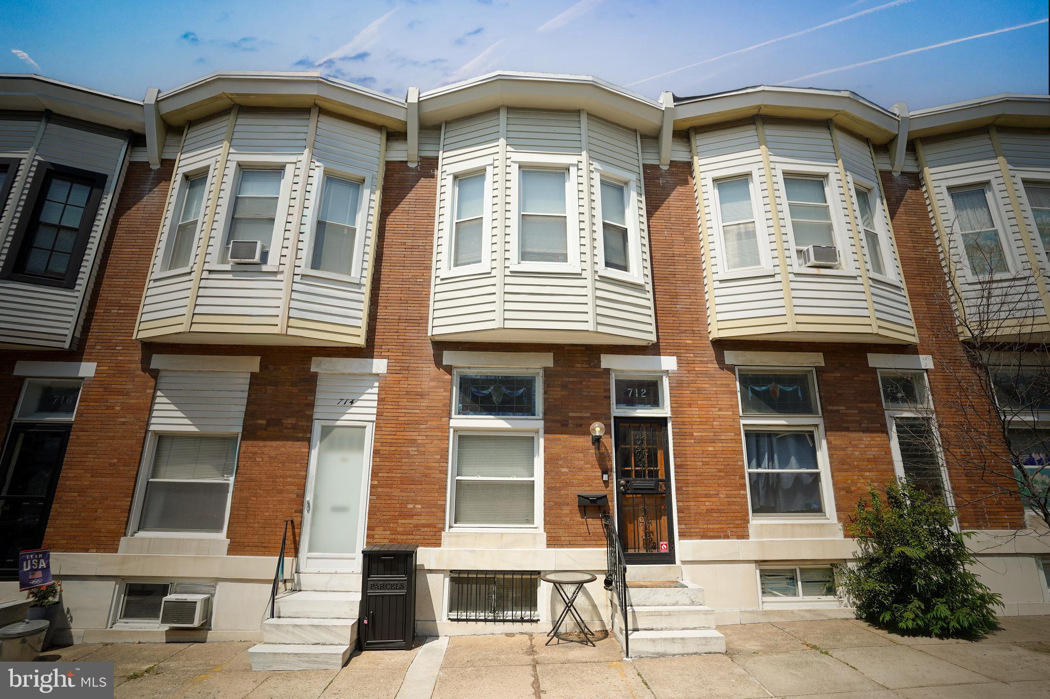 Charming 3BR/2BA Canton rowhome featuring three finished levels, exposed brick, hardwood floors, and abundant natural light throughout. Updated kitchen with granite countertops and stainless steel appliances opens to a private rear deck and off-street parking pad. Spacious primary suite with sitting area or home office, finished lower level with third bedroom and full bath, plus central A/C and in-unit laundry. Ideally located just blocks from Patterson Park, Canton Square, Canton Crossing, and all the neighborhood's popular shops and restaurants.