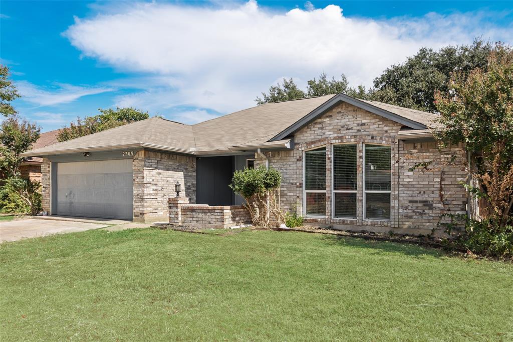 Charming 3-bedroom, 2-bath home ideally located near Highway 161, with plenty of shopping and dining options nearby. This inviting property features an open floor plan filled with natural light, highlighted by wood floors, a skylight, and a brick fireplace in the living area. The modern kitchen includes stainless steel appliances, granite countertops, and generous cabinet space. The spacious primary suite offers a stand-up shower, double sinks, and a granite vanity. With its bright interior and convenient location, this home perfectly blends comfort, style, and accessibility.