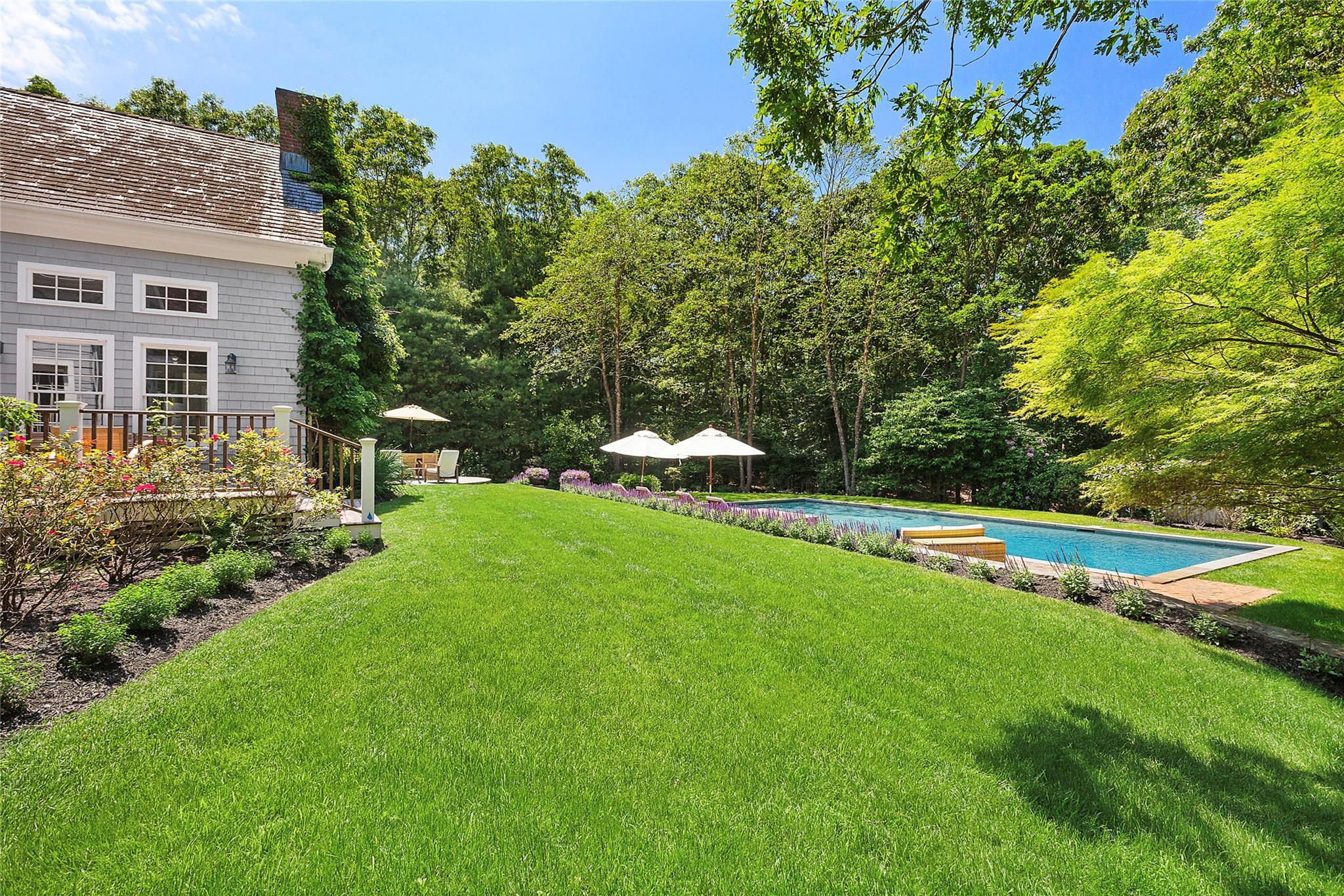 This traditional home has a gorgeous appeal both inside and out. From the top level landscaping to the picture perfect entry way, the property checks all the boxes. The first steps inside are welcoming and bright, with a large den/office space and open entry into the formal living room and professional kitchen. The top of the line kitchen is eat-in and flows out to a comfortable sitting room and patio space. The double height living space has a fireplace and is centrally laid out for entertaining. A large primary on the first floor; this four bedroom home also works as a five total bedroom home. Totaling 7,000 sqft with the finished lower level; any large family can find space to work, play or have a quiet moment. The back yard only continues the eloquence of the property with a built in grill, overside 44x20 gunite pool and mature landscaping that blooms all summer. This home is one of a kind and price to sell.